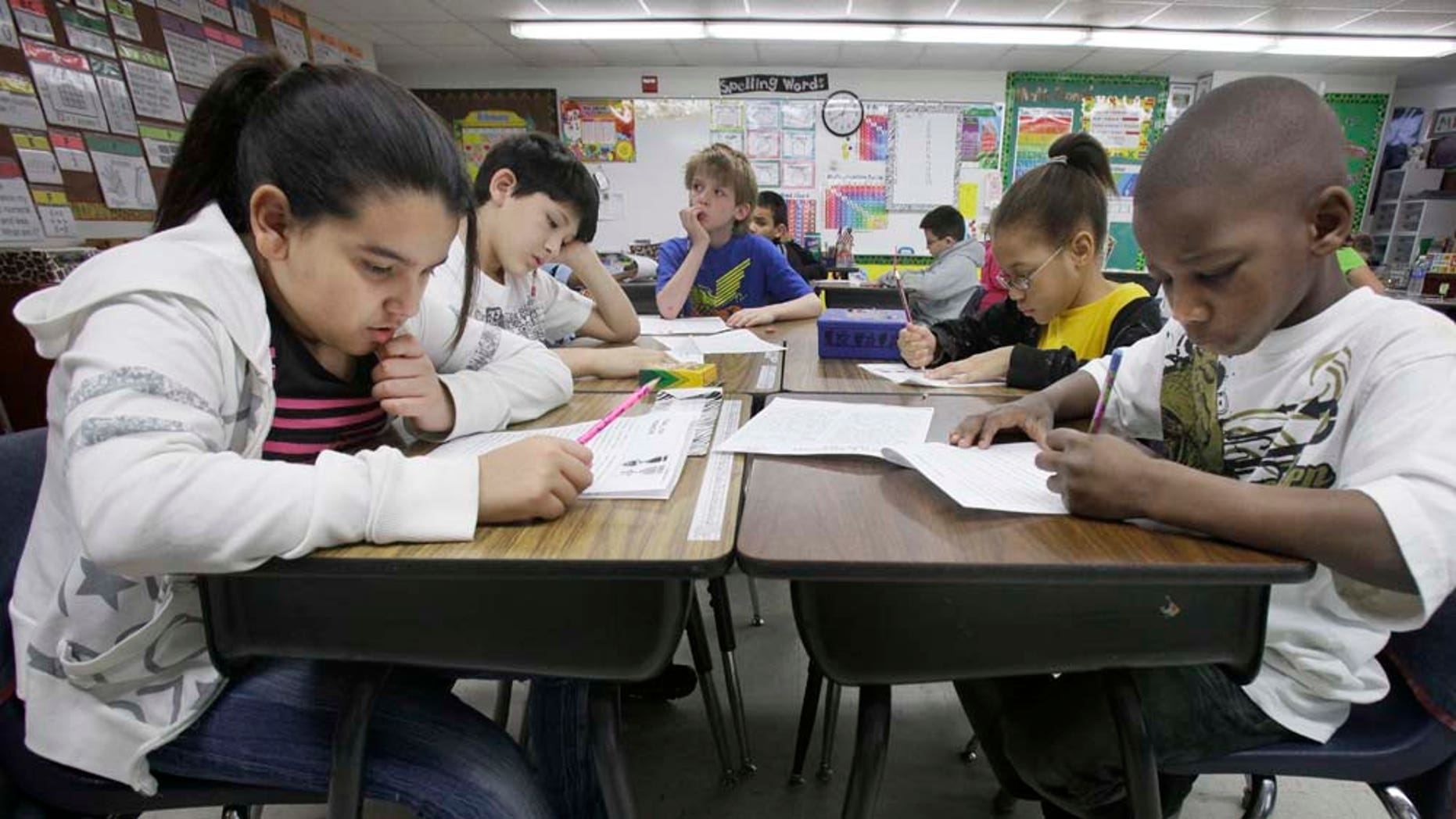 In this photo made Tuesday, Feb. 15, 2011, third grade students do school work during class at Hanby Elementary School in Mesquite, Texas. Mesquite ISD, like many districts in Texas, has seen a demographic shift in the racial make up students over the past 10 years. Hispanics account for two-thirds of Texas' growth over the past decade and now make up 38 percent of the state's total population, according to new local U.S. Census figures released Thursday, Feb. 17, 2011. (AP Photo/LM Otero) (AP Photo/LM Otero)