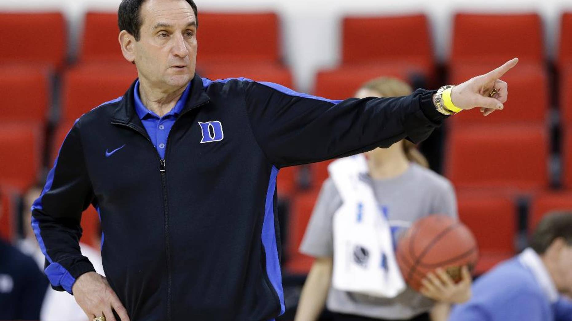 March 20, 2014: Duke head coach Mike Krzyzewski directs his team during practice at the NCAA college basketball tournament in Raleigh, N.C.