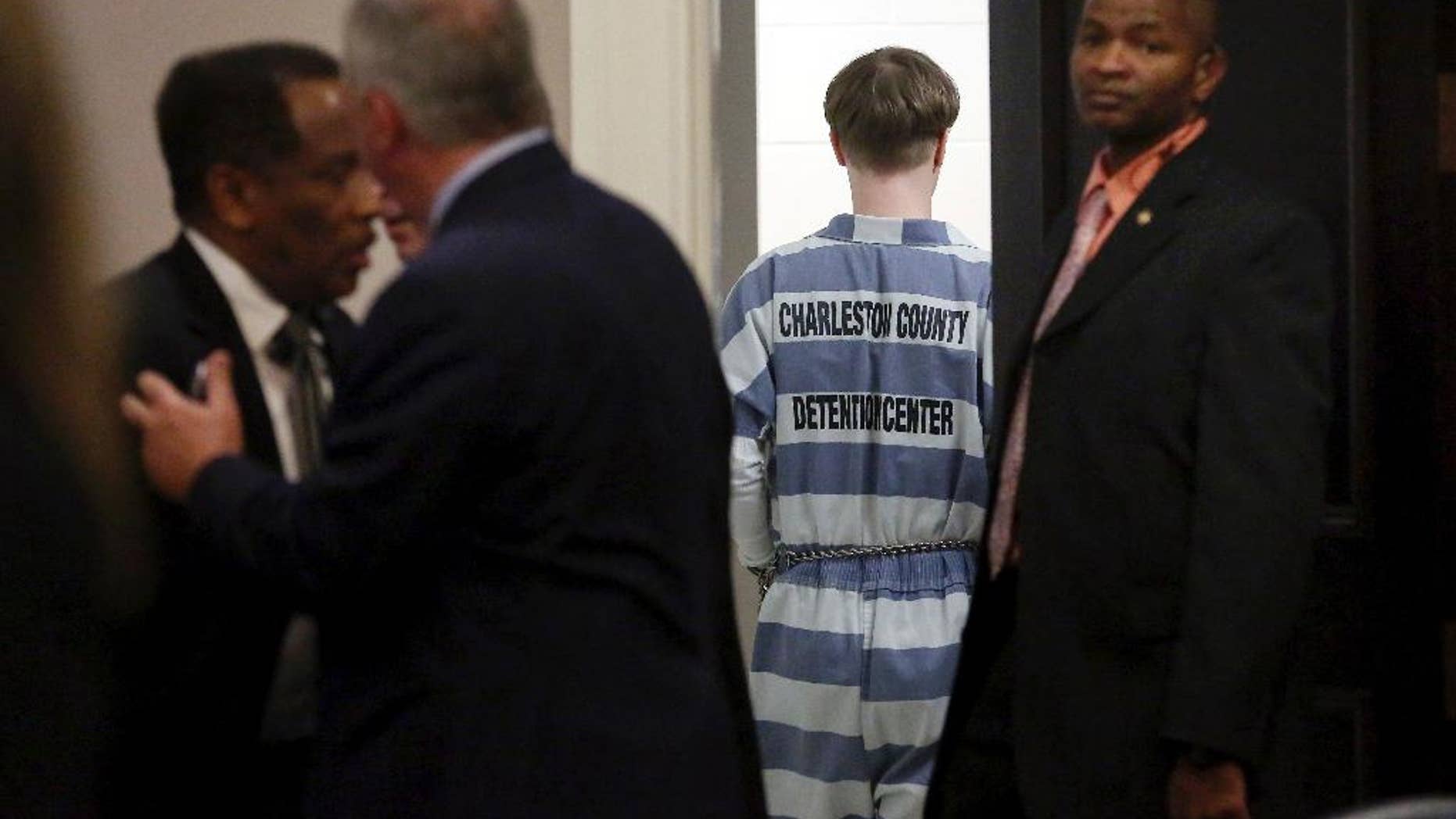 Dylann Roof leaves the Charleston County Court Monday April 10, 2017 after he pleaded guilty to nine murder charges from the shooting at Emanuel AME in Charleston, S.C. The convicted Charleston church shooter, Roof was given nine consecutive life sentences in state prison after he pleaded guilty to state murder charges Monday, leaving him to await execution in a federal prison and sparing his victims and their families the burden of a second trial. (Grace Beahm/The Post And Courier via AP, Pool)