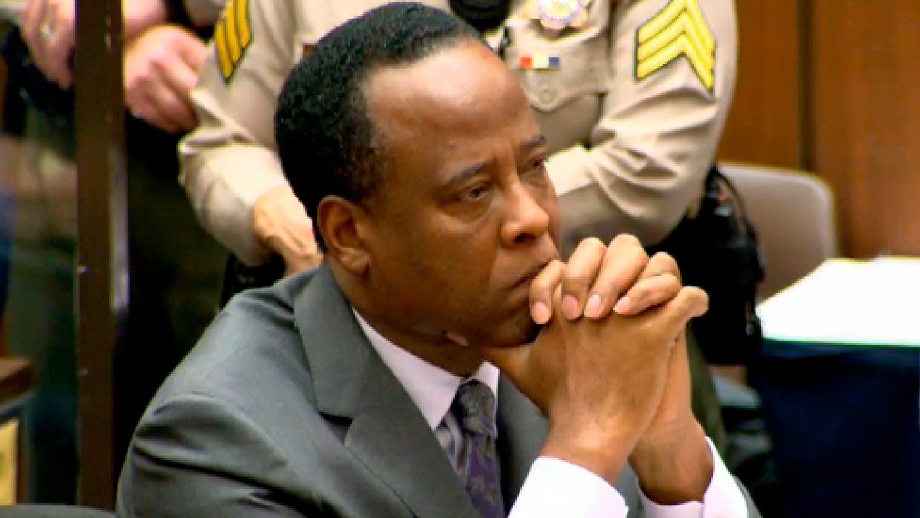 Dr. Conrad Murray listens as Judge Michael Pastor sentences him to four years in county jail for his involuntary manslaughter conviction of pop star Michael Jackson. (REUTERS/CNN/Pool)