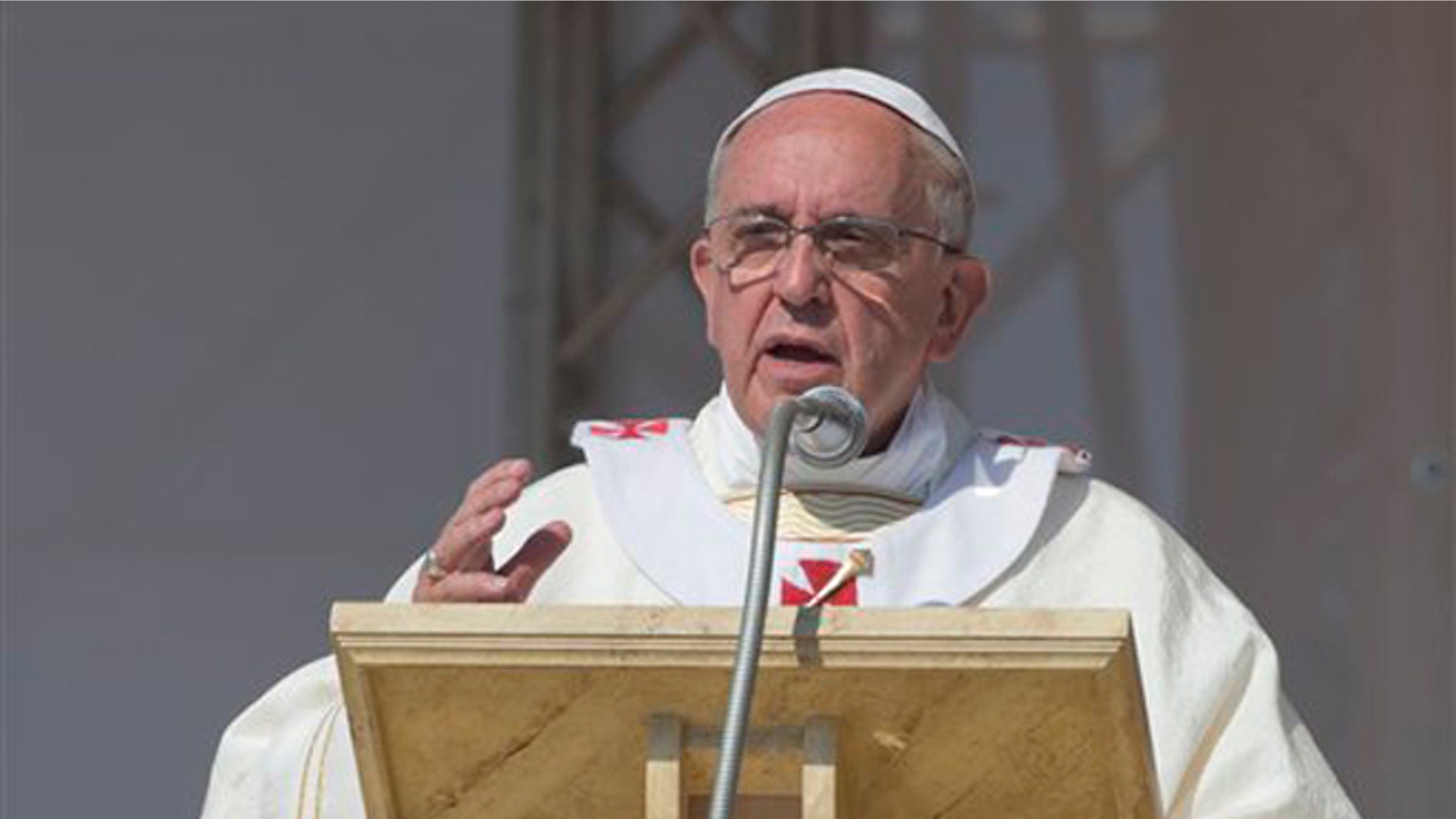 Pope Francis celebrates a Mass in Sibari, southern Italy, Saturday, June 21, 2014. Pope Francis paid a one day visit to Castrovillari, Sibari, and Cassano allo Jonio, in the Calabria region of Italy. Pope Francis comforted the imprisoned father of a slain toddler during a visit Saturday to a southern Italian region infested by one of the world's most powerful crime syndicates. During his one-day pilgrimage to Calabria, Francis met separately with the father and two grandmothers of Coco' Campolongo in the courtyard of a prison in the town of Castrovillari. (AP Photo/Alessandra Tarantino)