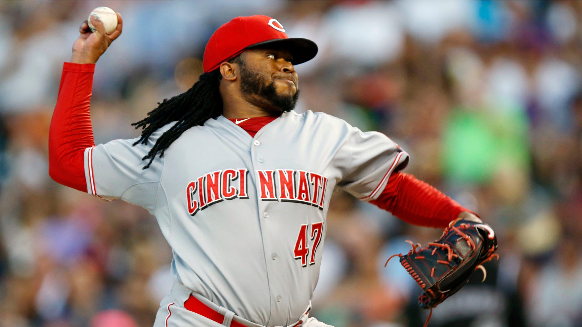Cincinnati Reds starting pitcher Johnny Cueto works against the Colorado Rockies in the seventh inning of a baseball game Saturday, July 25, 2015, in Denver. Cincinnati won 5-2. (AP Photo/David Zalubowski)