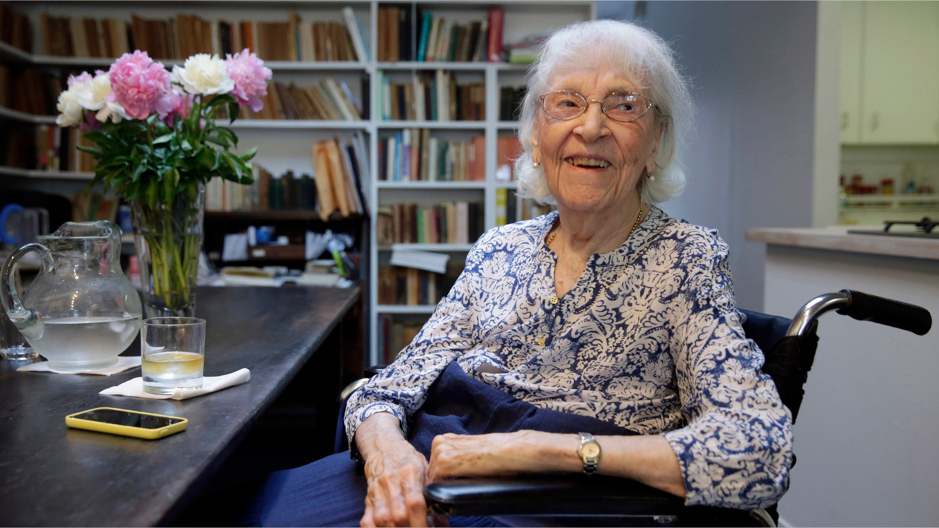 In this Friday, May 29, 2015 photo, artist Carmen Herrera is interviewed in her New York studio. Herrera, who turned 100 on Sunday, May 31, says she's still bursting with ideas she wants to put on canvas. (AP Photo/Richard Drew)
