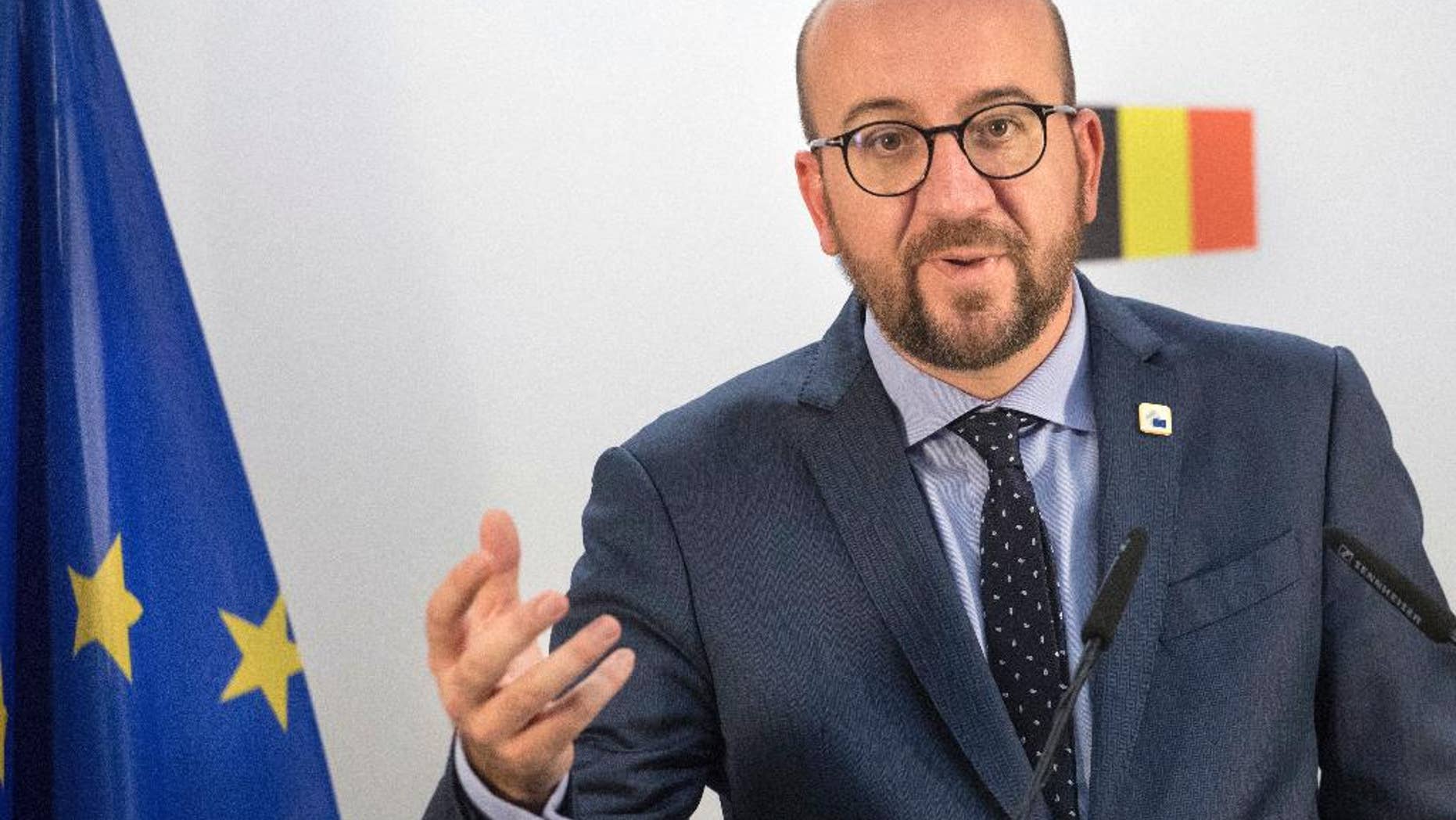 Belgian Prime Minister Charles Michel holds a press conference on the second day of the EU summit in Brussels, Friday, Oct. 21, 2016. The European Union was scrambling Friday to salvage a massive free trade deal with Canada that was being held up by a small region in Belgium. (AP Photo/Olivier Matthys)