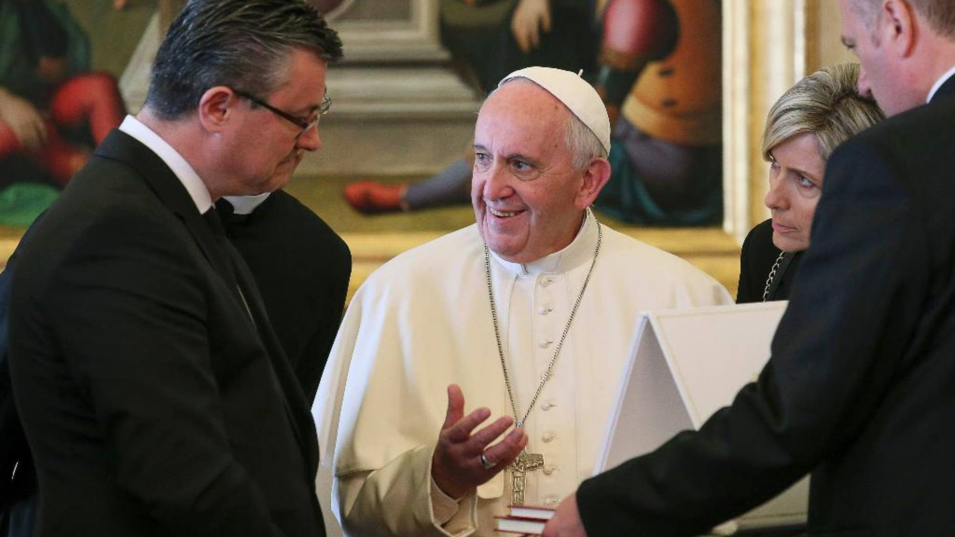 Pope Francis speaks with Croatian Prime Minister Tihomir Oreskovic, left, and his wife Sanja Dujmovic, right, on the occasion of their private audience, at the Vatican, Thursday, April 7, 2016. (Alessandro Di Meo/Pool Photo via AP)