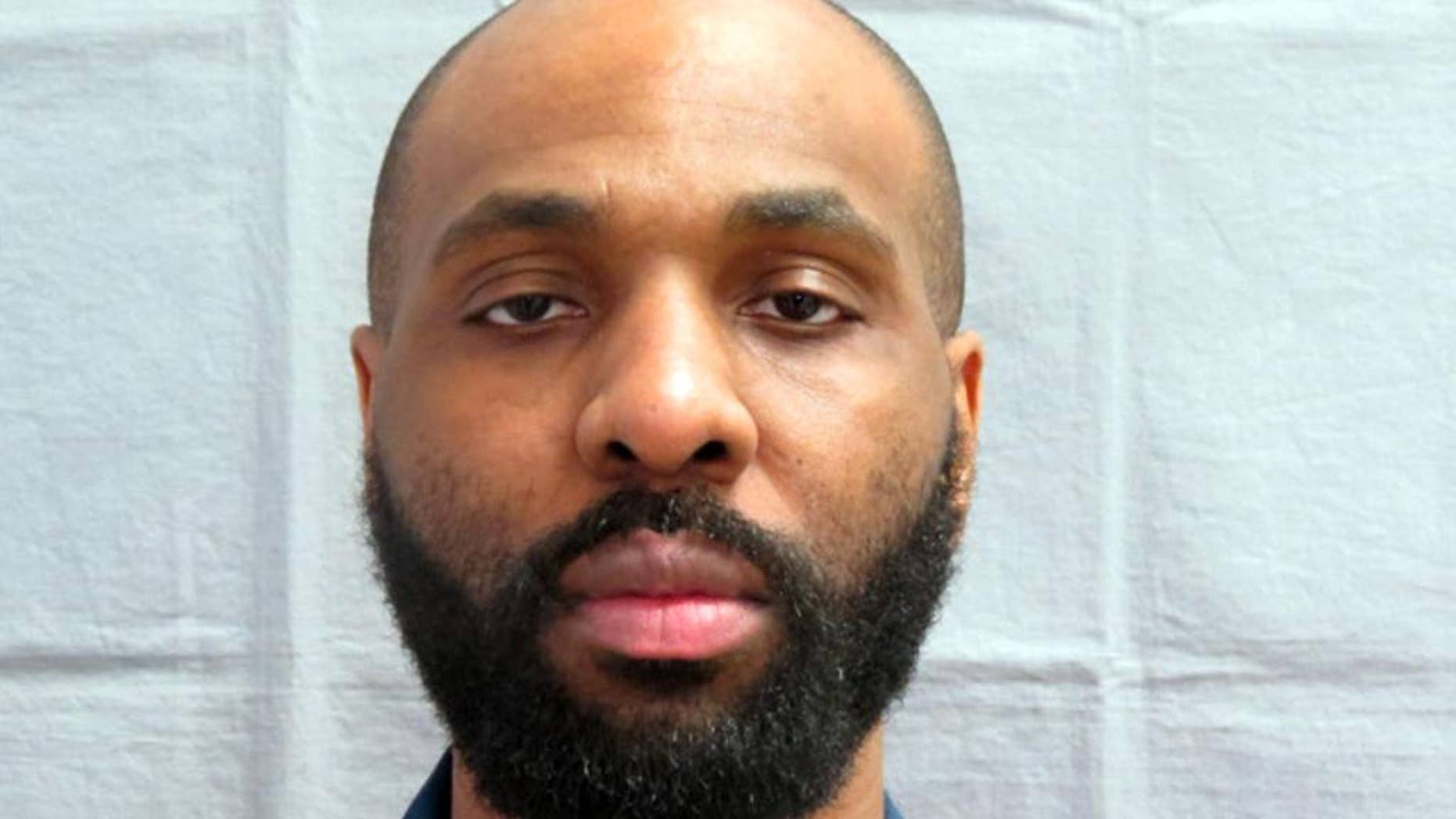 In this photo taken on March 30, 2013 provided by the Michigan Department of Corrections, Nosakhare Onumonu appears in a booking mug. A unique glove and a DNA match helped lead to a conviction in the 1999 slaying of an 84-year-old woman whose body was found in an alley behind a church on Detroit's west side, authorities said. A report in the Detroit Free Press details the case that led to Onumonu being convicted of first-degree murder and felony murder. The 38-year-old man is scheduled to be sentenced Friday, Aug. 21, 2015, to the mandatory term of life in prison without the possibility of parole. (Michigan Department of Correction via AP)