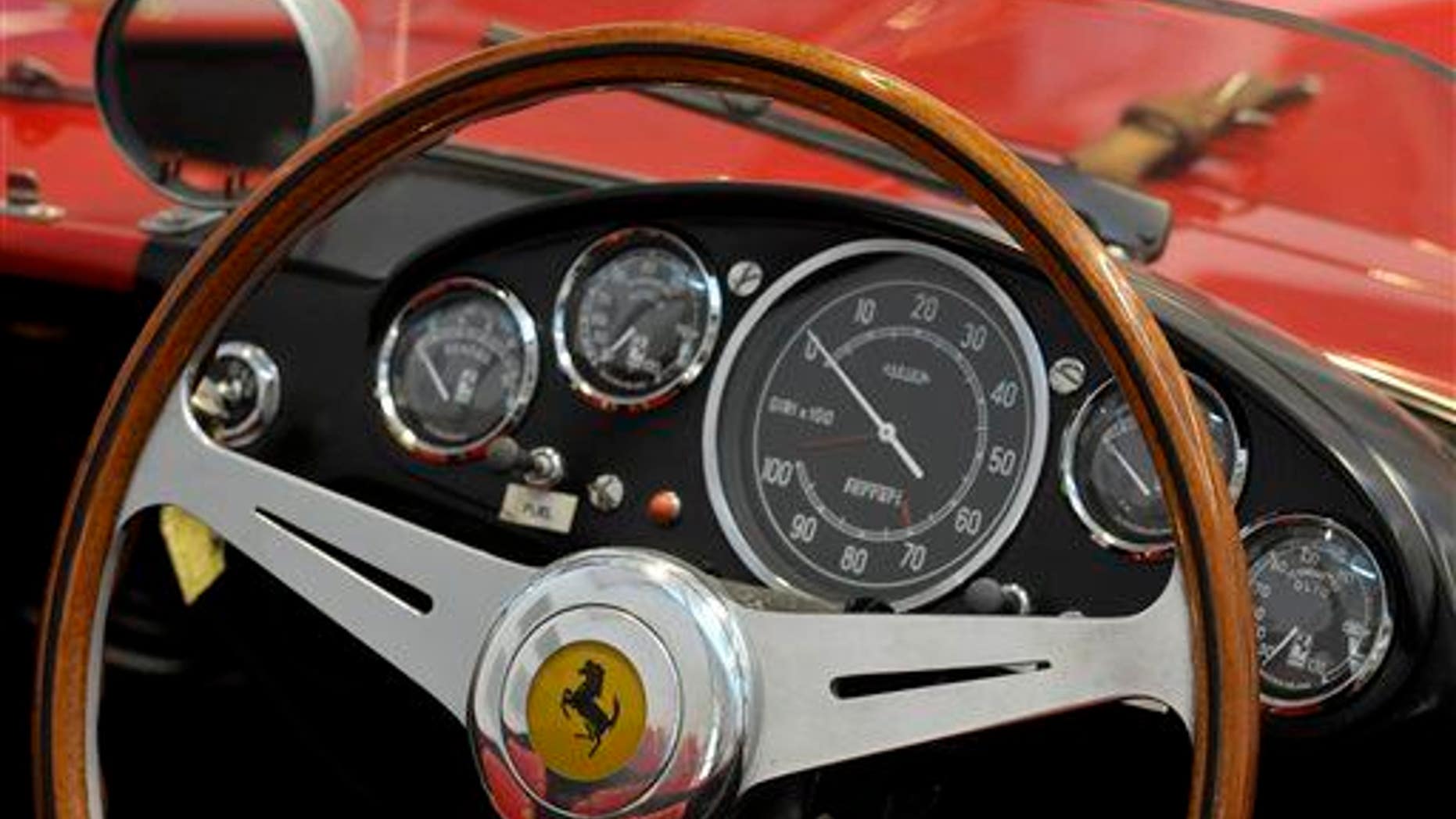 This file photo shows a Ferrari logo on a steering wheel at the Ferrari department factory in Maranello, Italy.