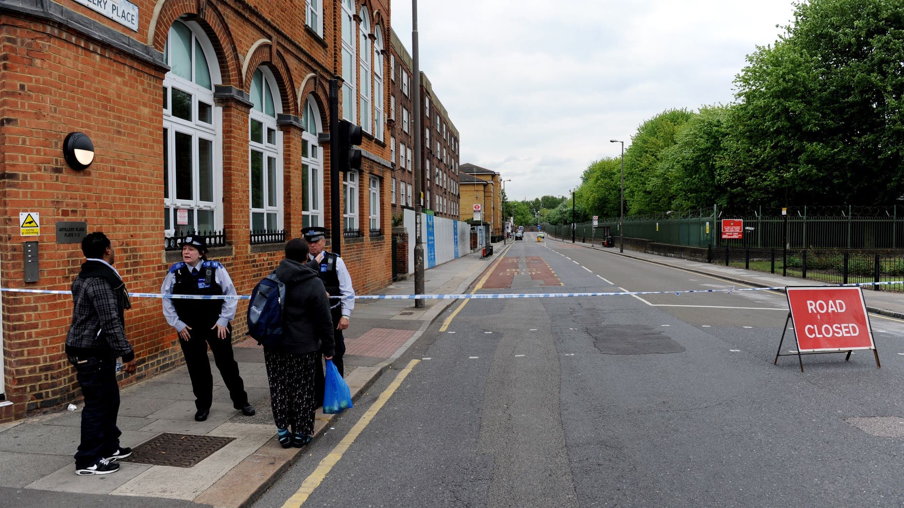 Artillery Place road is closed in Woolwich southeast London near the scene where British officials said one person has died and at least two people have been wounded in an attack on Wednesday May 22, 2013. (AP Photo/Nick Ansell/PA) UNITED KINGDOM OUT