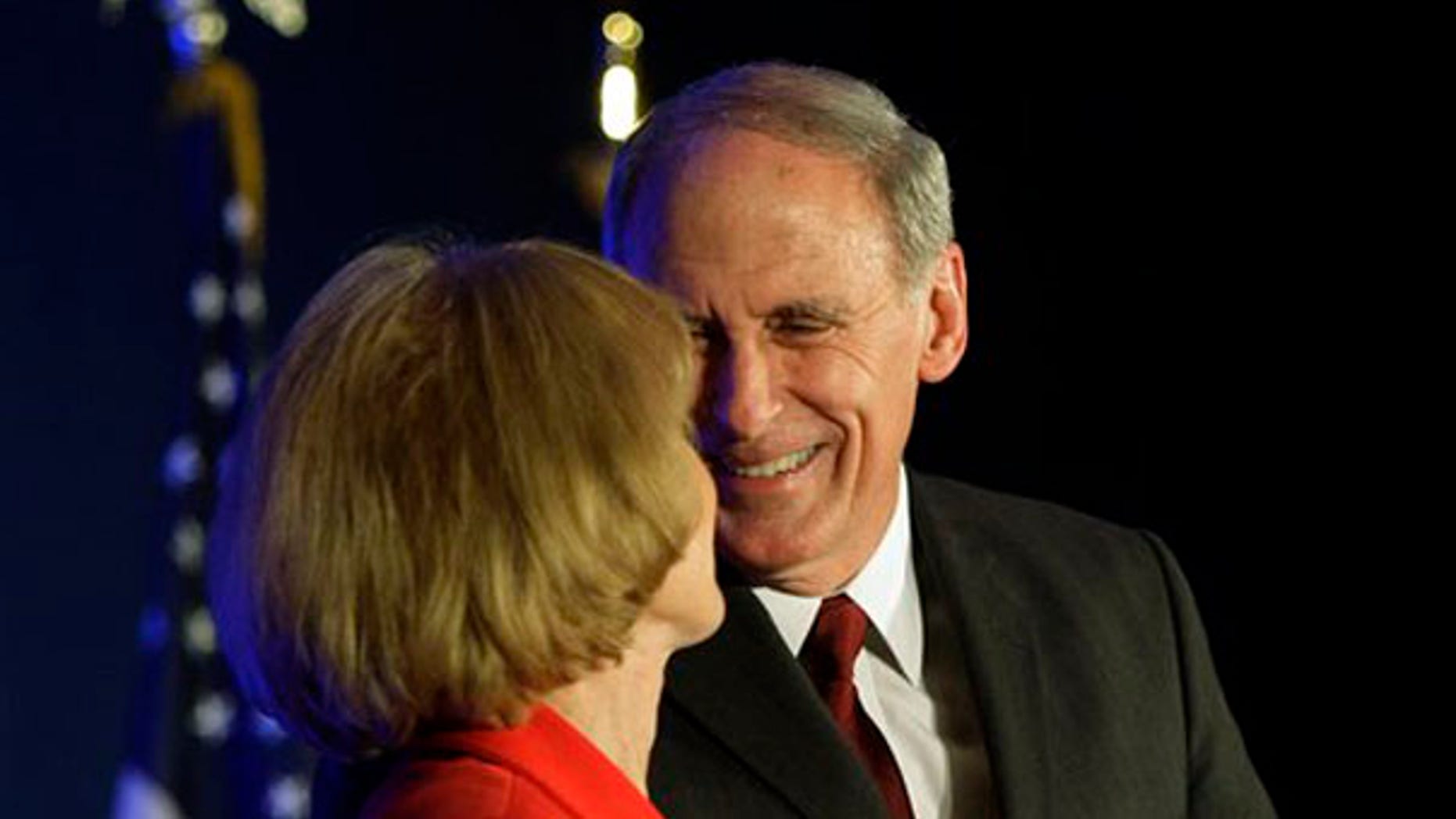 Sen. Dan Coats is greeted by his wife, Marsh, in Indianapolis.