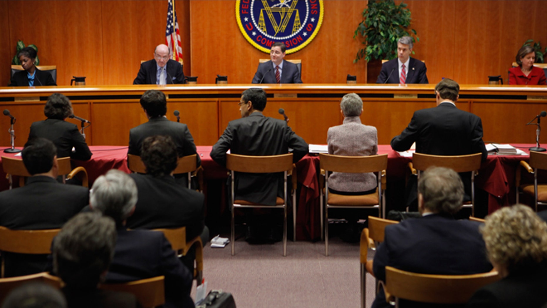 WASHINGTON, DC - DECEMBER 21: Federal Communications Commission Commissioners (L-R) Mignon Clyburn, Michael Copps, Chairman Julius Genachowski, Robert McDowell and Meredith Attwell Baker deliver opening remarks before they voted 3-2 to adopted controversial Net neutrality rules December 21, 2010 in Washington, DC. The rules put into effect by the commission create two different classes of broadband internet service -- one for fixed networks and another for wireless networks -- due to their technological differences. (Photo by Chip Somodevilla/Getty Images) *** Local Caption *** Mignon Clyburn;Michael Copps;Robert McDowell;Julius Genachowski;Meredith Attwell Baker