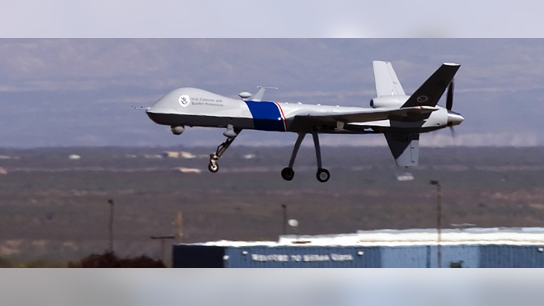 SIERRA VISTA, AZ - OCTOBER 30: The new MQ-9 Predator B, an unmanned surveillance aircraft system, unveiled by the U.S. Customs and Border Protection (CBP), takes off at Libby Army Airfield at Ft. Huachuca October 30, 2006 in Sierra Vista, Arizona. CBP will use the new MQ-9 Predator aircraft to patrol the southern border of the United Sates in order to stop the illegal entry of thousands of Mexican nationals and drug runners who use the vast expanses of the Sonoran desert to cross into southern Arizona, daily. The new unarmed plane flew briefly for the press to show off its surveillance capabilities by pilots of the contractor, General Atomics Aeronautical Systems. Agents of CBP will start training on the use of the aircraft very soon. The Predator will start full scale flight operations along the Mexico-Arizona border today. (Photo by Gary Williams/Getty Images)