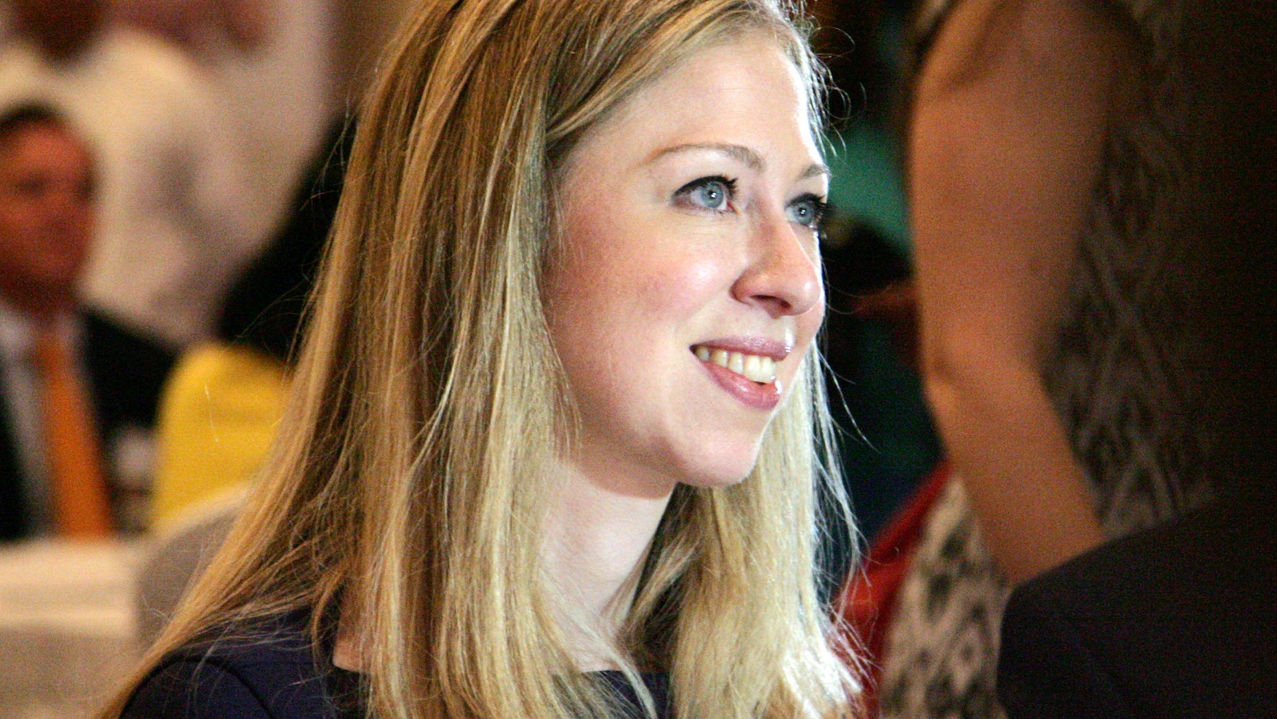 Chelsea Clinton, daughter of former U.S. President Bill Clinton, attends a launching ceremony of Children’s safe drinking water (CSDW) program in Yangon, Myanmar, Monday, May 27, 2013. Clinton marked the 6 billionth liter of clean water in Myanmar Monday providing water purifier packets to provide safe and clean drinking water. (AP Photo/Khin Maung Win)