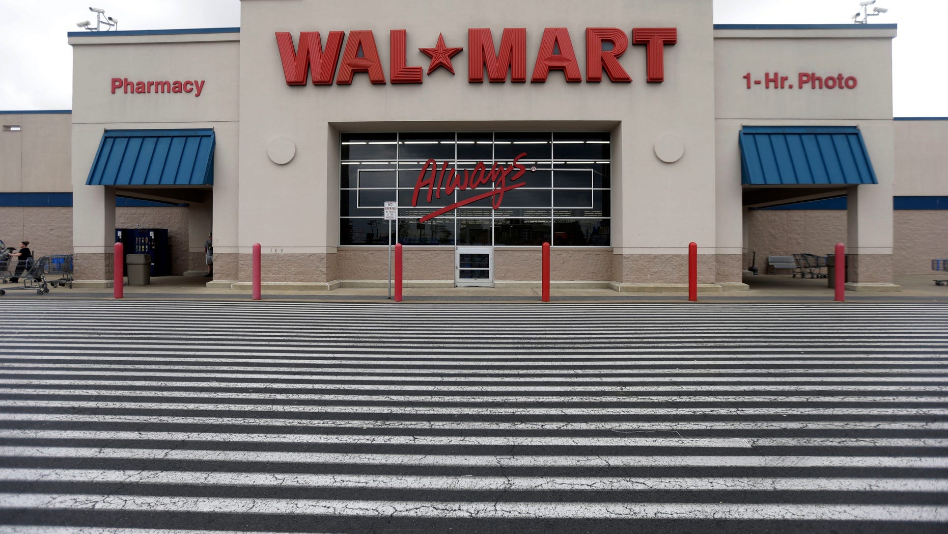 FILE - This July 12, 2013, file photo, shows a Wal-Mart, in Bristol, Pa. Wal-Mart Stores Inc. reports quarterly financial results on Thursday, Nov. 14, 2013. (AP Photo/Matt Rourke, File)