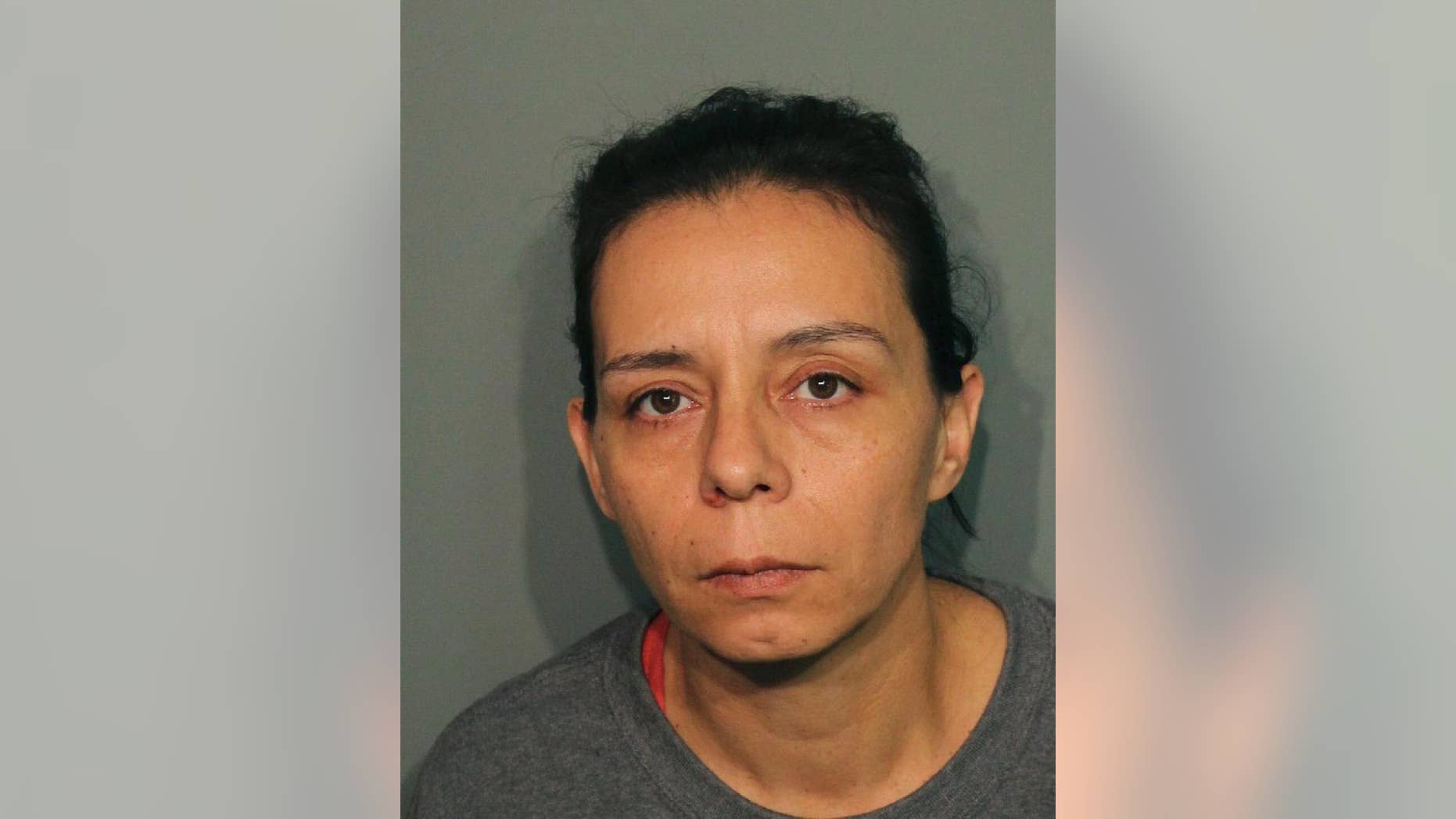 This booking photo released Wednesday, Sept. 21, 2016, by the Calaveras County Sheriff's Office shows Guadalupe Sierra Arrellano in San Andreas, Calif. Arrellano is one of two women arrested on charges of holding multiple men captive at an illegal marijuana plantation in Northern California and forcing them to work there for several months. Calaveras County Sheriff's Capt. Jim Macedo said Wednesday the men fled the secluded, rural camp in July after overhearing they would be murdered after the harvest. (Calaveras County Sheriff's Office via AP)