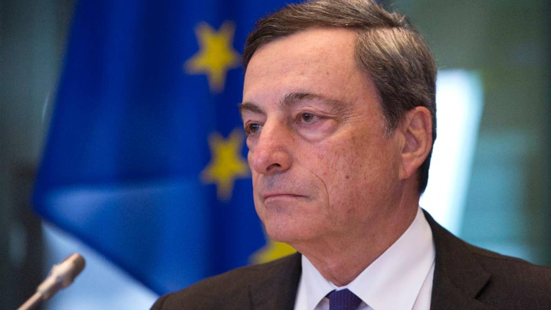 FILE - In this Monday, Sept. 26, 2016 file photo, Governor of the European Central Bank Mario Draghi pauses during a session of the Economic and Monetary Affairs Committee at the European Parliament in Brussels. Investors will sift European Central Bank head Mario Draghi’s remarks on Thursday, Oct. 20. 2016 for clues about a possible extension of its 1.74 trillion euro ($1.91 trillion) bond-buying stimulus program. (AP Photo/Virginia Mayo, File)