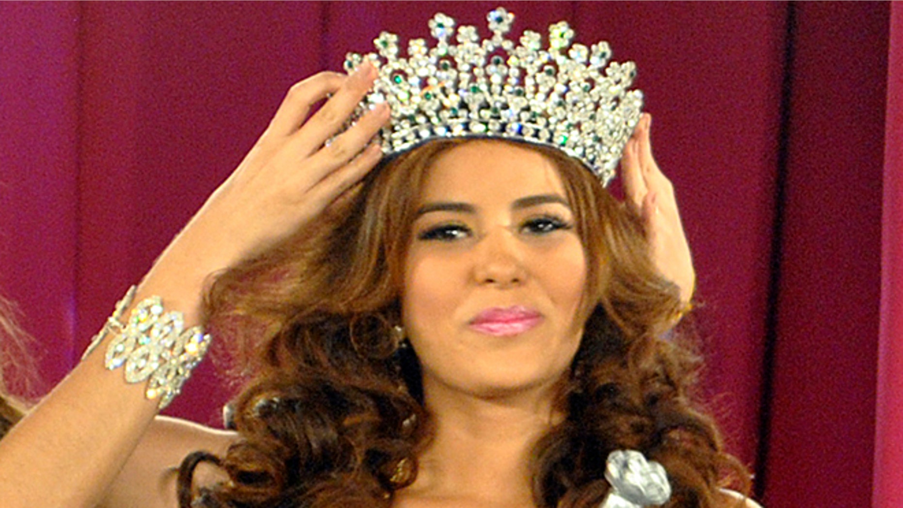 In this April 26, 2014 photo, Maria Jose Alvarado is crowned the new Miss Honduras in San Pedro, Sula, Honduras. Alvarado, and her sister Sofia disappeared after attending a birthday party in Western Honduras on Thursday Nov. 13, but authorities were not notified until the weekend. The 19-year-old beauty queen was expected to attend the Miss World pageant in Britain this December. (AP Photo)