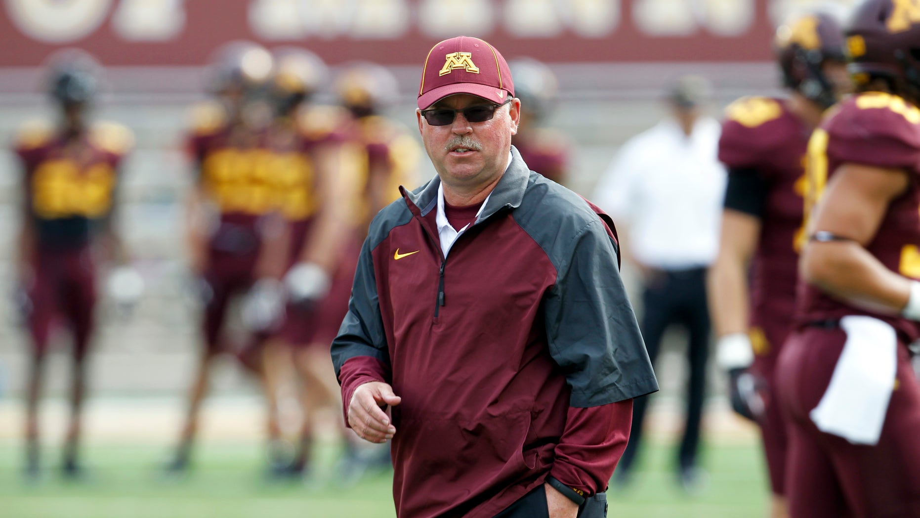 FILE - In this Sept. 21, 2013, file photo, Minnesota head coach Jerry Kill watches his team prior to an NCAA college football game against San Jose State in Minneapolis. Kill has suffered another seizure and did not make the trip with the Golden Gophers to face No. 19 Michigan on Saturday, Oct. 5, 2013. (AP Photo/Ann Heisenfelt, File)
