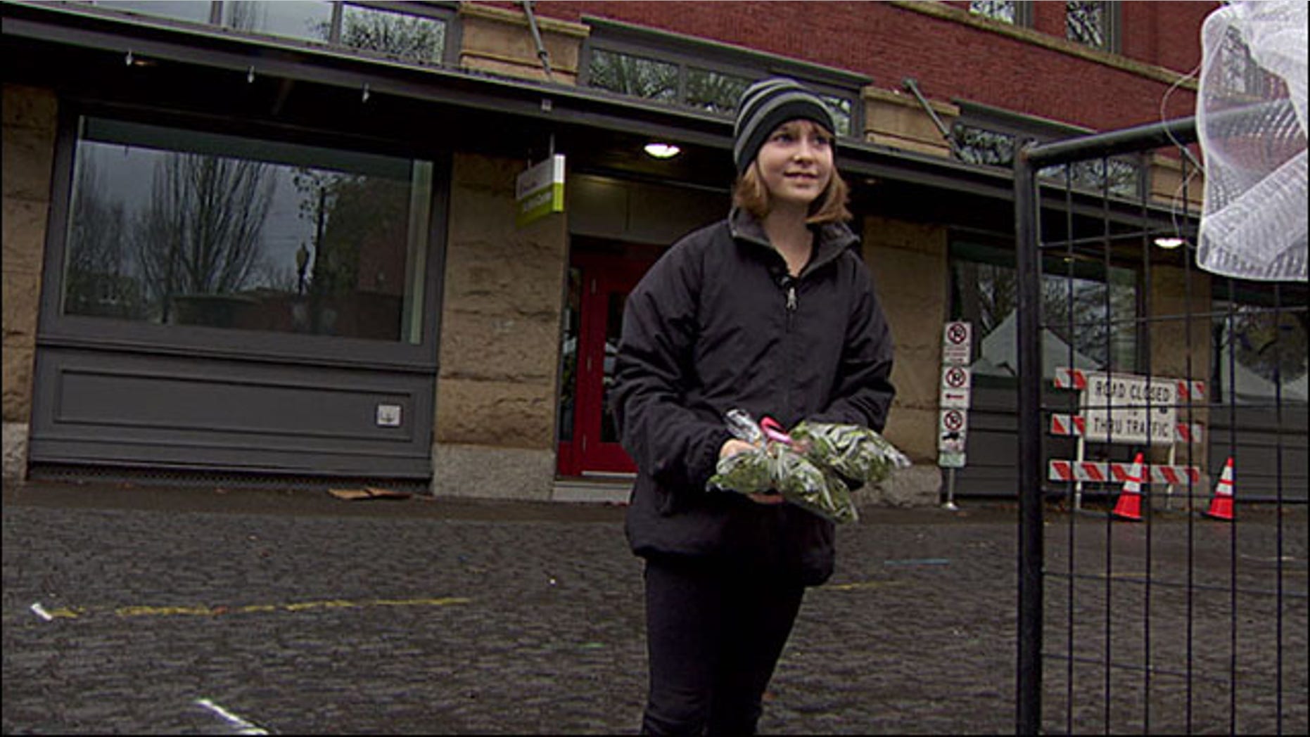 Madison Root, 11, holding some of the mistletoe she was told not to sell. (Courtesy KATU)