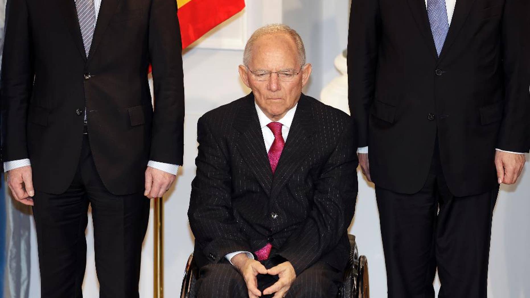 German Finance Minister Wolfgang Schaeuble, center, attends a New Year's reception of German President Joachim Gauck at the Bellevue palace in Berlin, Germany, Tuesday, Jan. 10, 2017. (AP Photo/Michael Sohn)