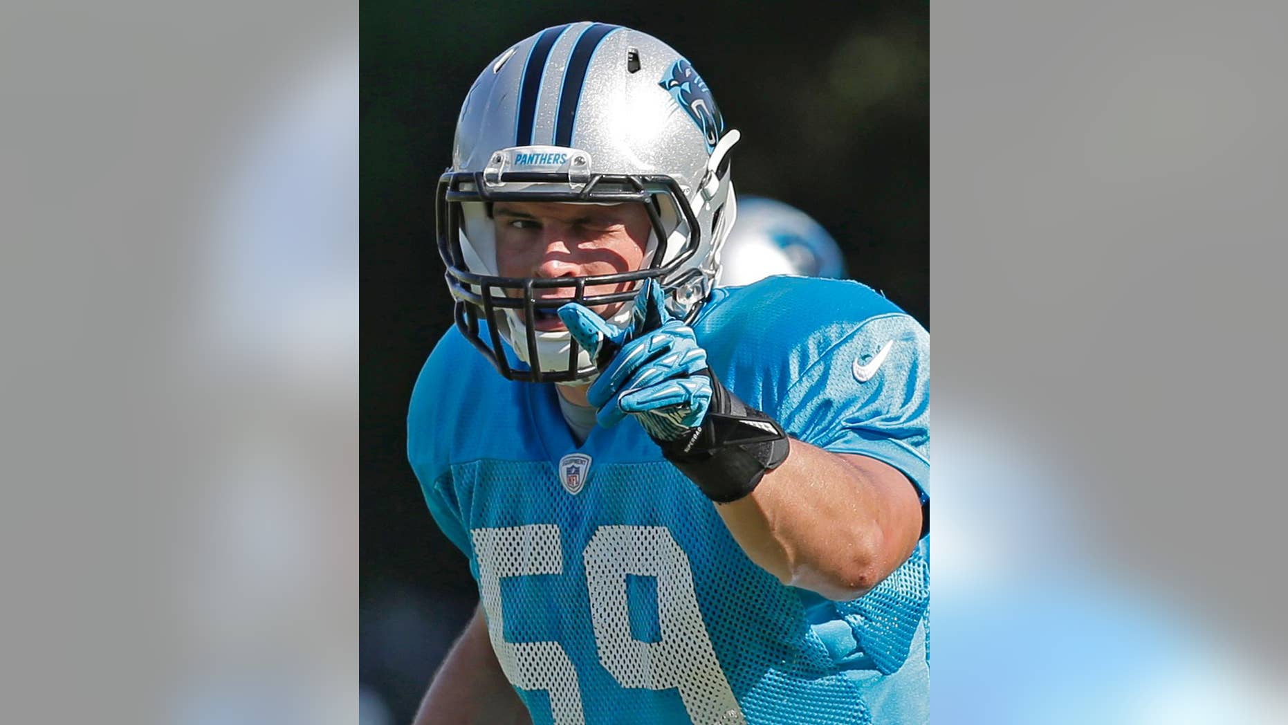 In this July 29, 2014, file photo, Carolina Panthers' Luke Kuechly (59) directs the defense during an NFL football practice at their training camp in Spartanburg, S.C. The AP’s Defensive Player of the Year in 2013, Kuechly is considered by Panthers coach Ron Rivera the team’s “defensive quarterback” on the field. (AP Photo/Chuck Burton)