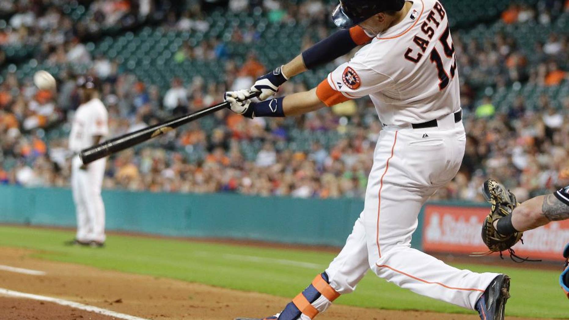 Houston Astros' Jason Castro hits a home run during the first inning of a baseball game against the Miami Marlins, Saturday, July 26, 2014, in Houston. (AP Photo/Patric Schneider)