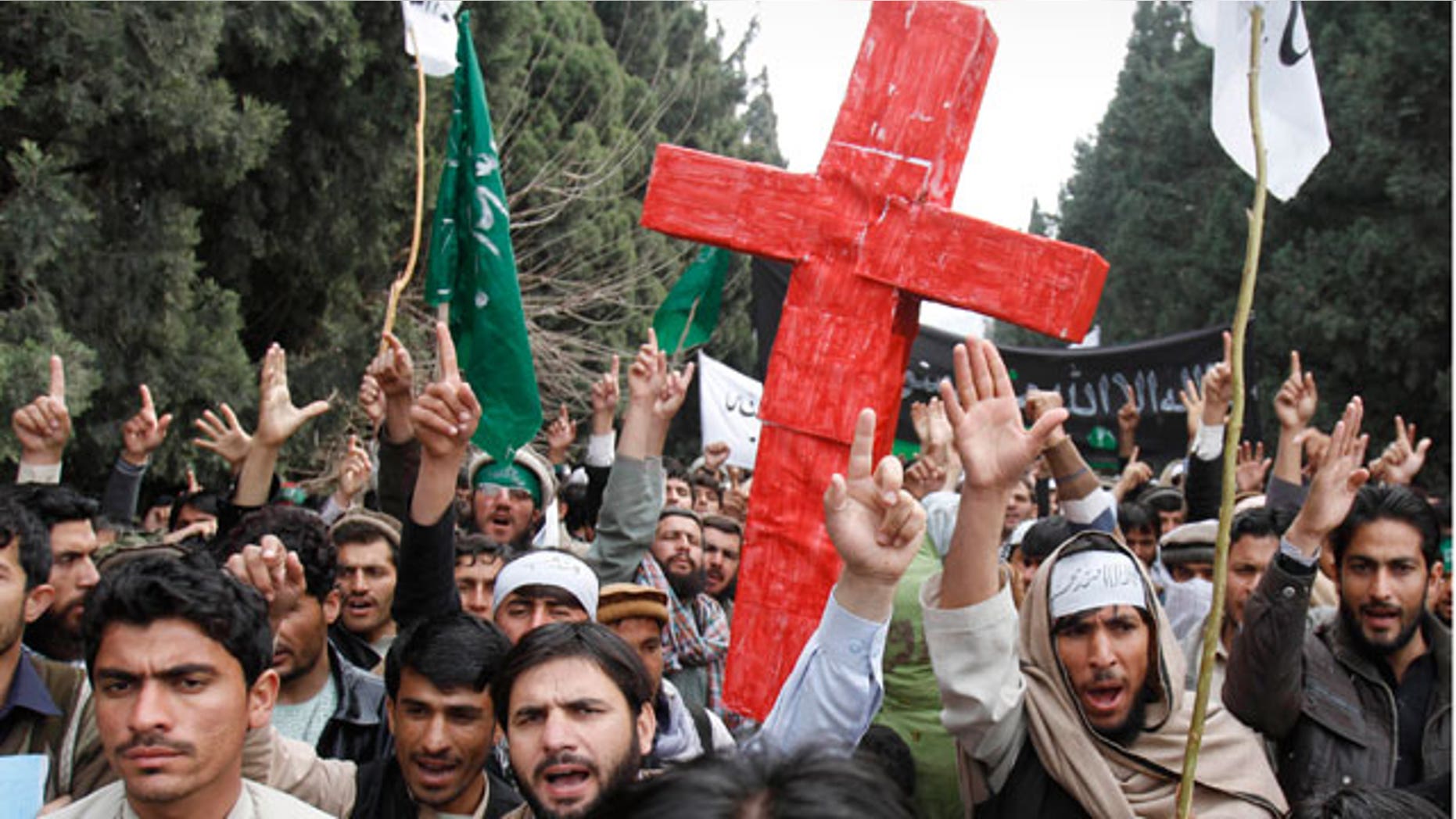 Mar. 13, 2012: Demonstrators chant anti U.S. slogans as they carry a red cross following Sunday's killing of civilians in Panjwai, Kandahar by a U.S. soldier during a protest in Jalalabad east of Kabul, Afghanistan.