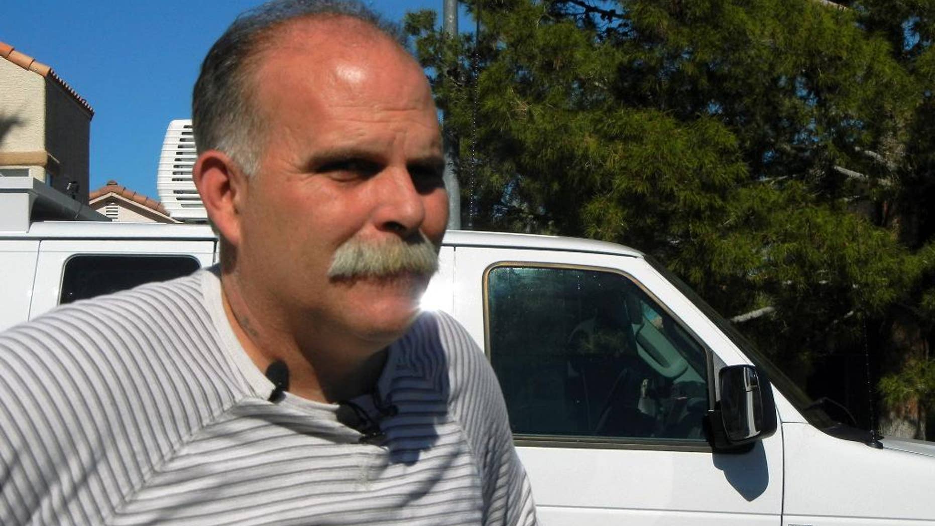 Robert Meyers speaks to media outside his house, Friday, Feb. 13, 2015 in Las Vegas. His wife Tammy who was teaching her 14-year-old daughter to drive was shot in the head and was not expected to survive after an apparent road-rage attack by an angry driver who followed them to their Las Vegas home. (AP Photo/Kimberly Pierceall)