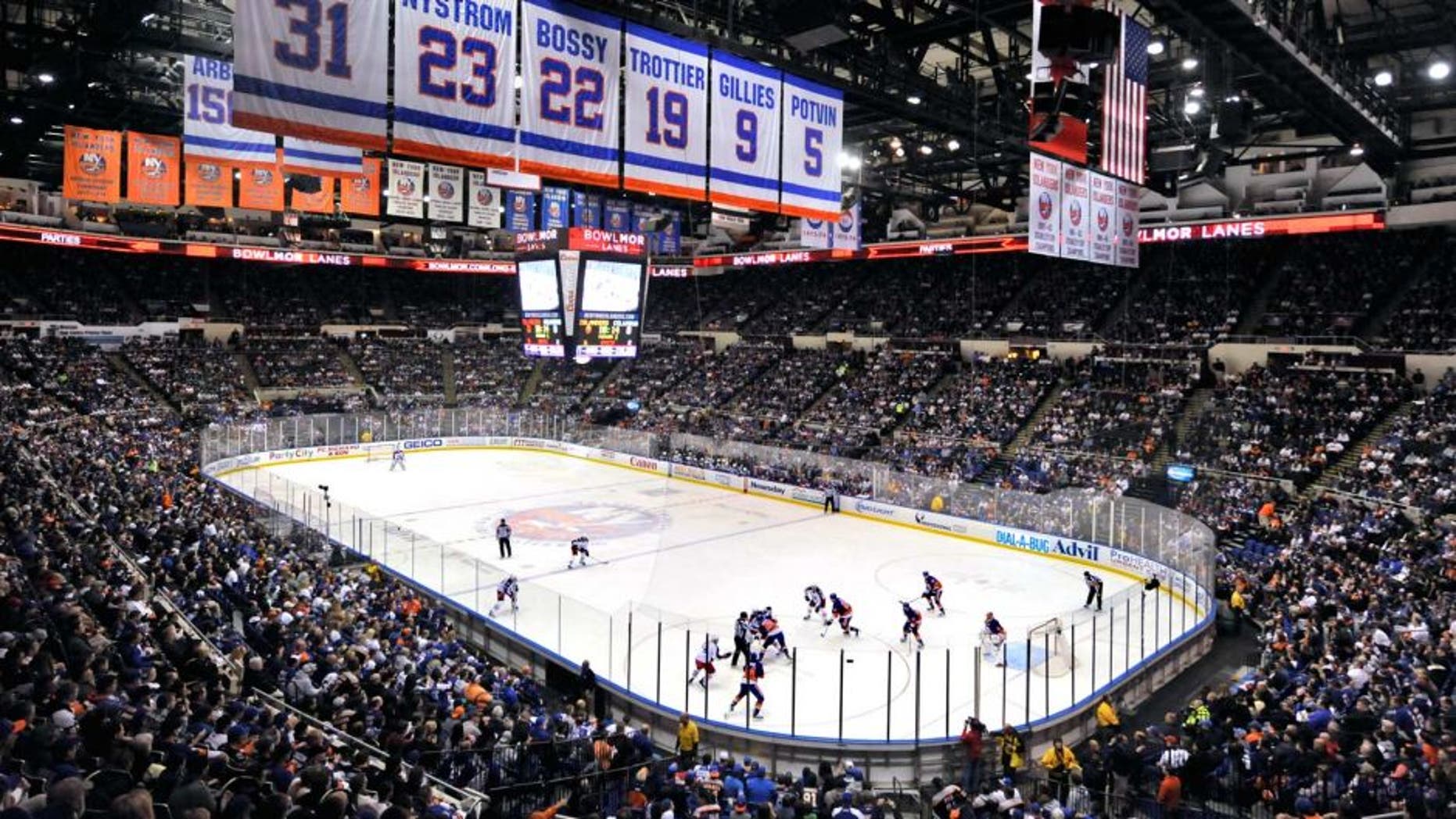 This April 11, 2015 file photo show the New York Islanders play against the Columbus Blue Jackets in the first period of the Islanders last regular season home game at the Nassau Veterans Memorial Coliseum, in Uniondale, NY. For loyal fans of the Islanders, this yearÃs playoff run is tinged with even more of a sense of finality, and yes, sadness. Win or lose, these will be the last games for Long IslandÃs only major pro sports franchise, which will move to Brooklyn at the end of the season. (AP Photo/Kathy Kmonicek, File)
