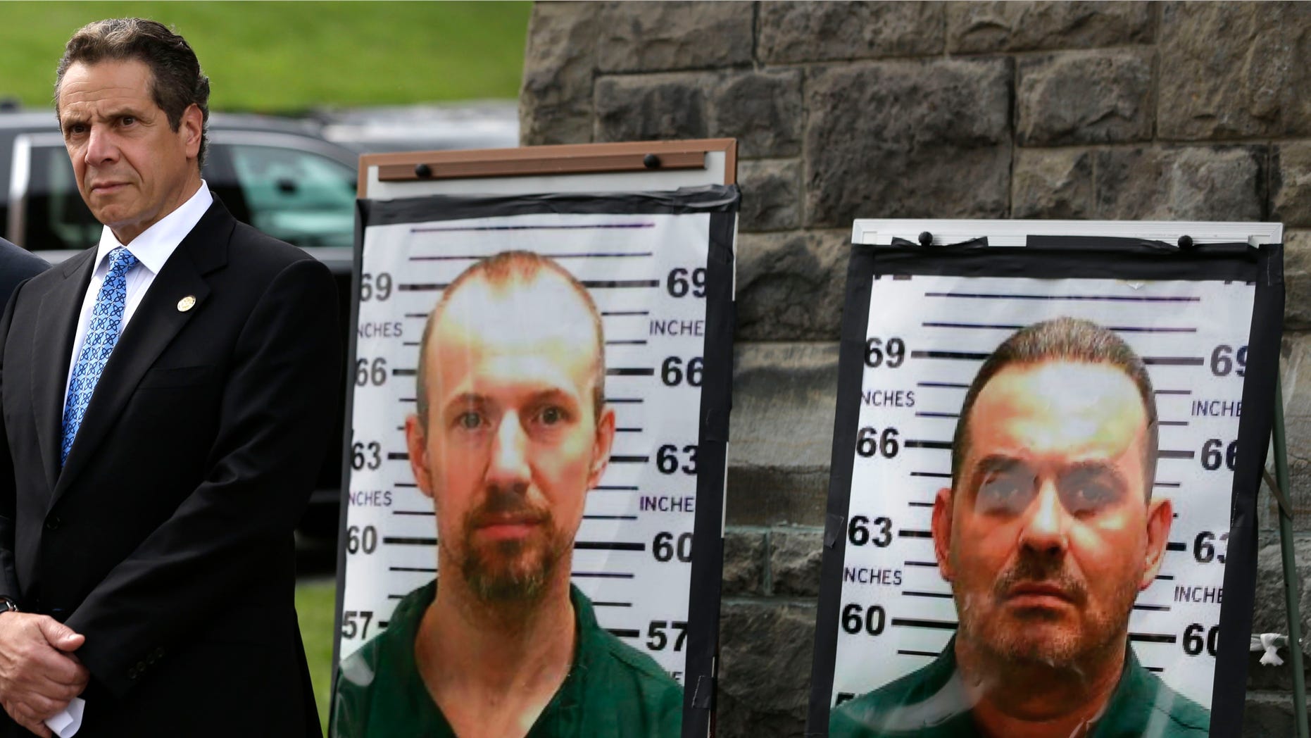 Vermont Governor Peter Shumlin, left, and New York Governor Andrew Cuomo listen during a news conference in front of the Clinton Correctional Facility in Dannemora, N.Y., Wednesday, June 10, 2015. Police were resuming house-to-house searches near the maximum-security prison in northern New York where David Sweat and Richard Matt, two killers escaped using power tools, authorities said Wednesday as they renewed their plea for help from the public. (AP Photo/Seth Wenig)
