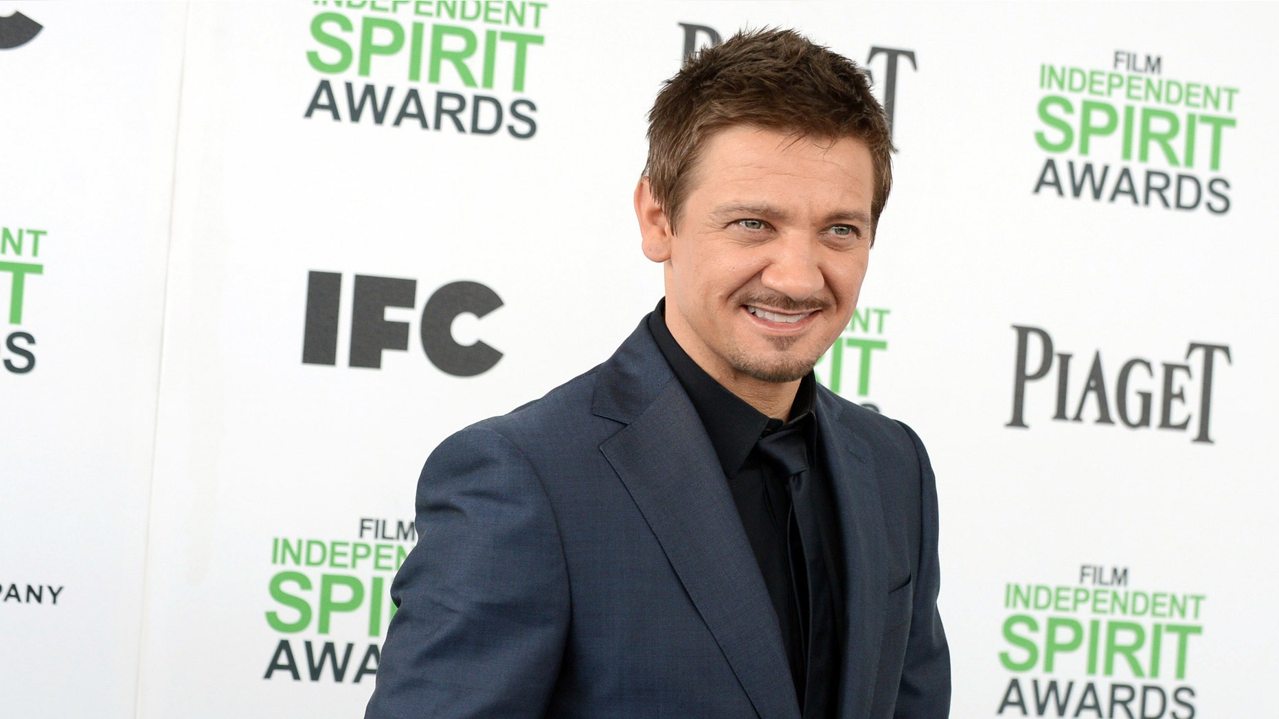 FILE - In this March 1, 2014 file photo, Jeremy Renner arrives at the 2014 Film Independent Spirit Awards, in Santa Monica, Calif. Attorneys for Renner and his estranged wife, model Sonni Pacheco, told a Los Angeles judge on Wednesday, April 1, 2015, that the pair had settled a custody dispute over their 2-year-old daughter. Pacheco filed for divorce from the two-time Academy Award nominee in December, less than a year after their wedding. (Photo by Jordan Strauss/Invision/AP, File)