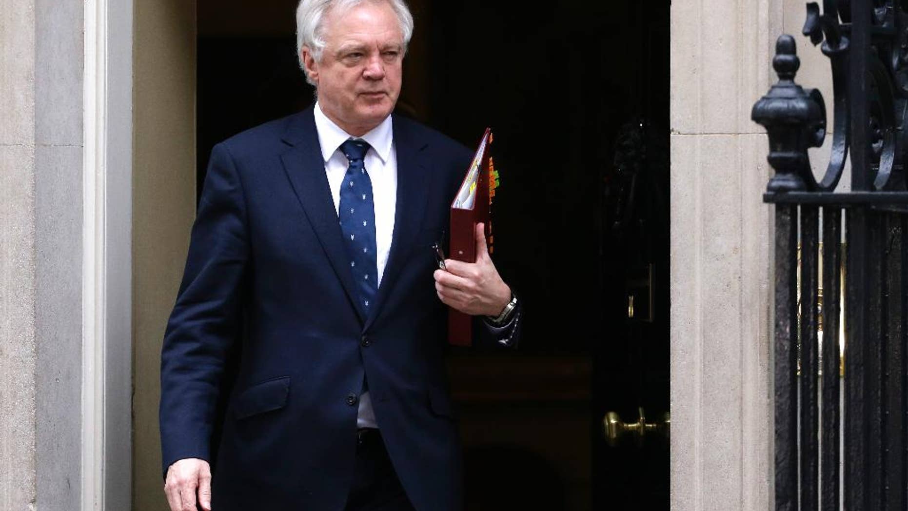 David Davis, Britain's Secretary of State for Exiting the European Union, leaves after a cabinet meeting in 10 Downing Street, London, Wednesday March 29, 2017. Britain will begin divorce proceedings from the European Union later on March 29, starting the clock on two years of intense political and economic negotiations that will fundamentally change both the nation and its European neighbors. (AP Photo/Alastair Grant)