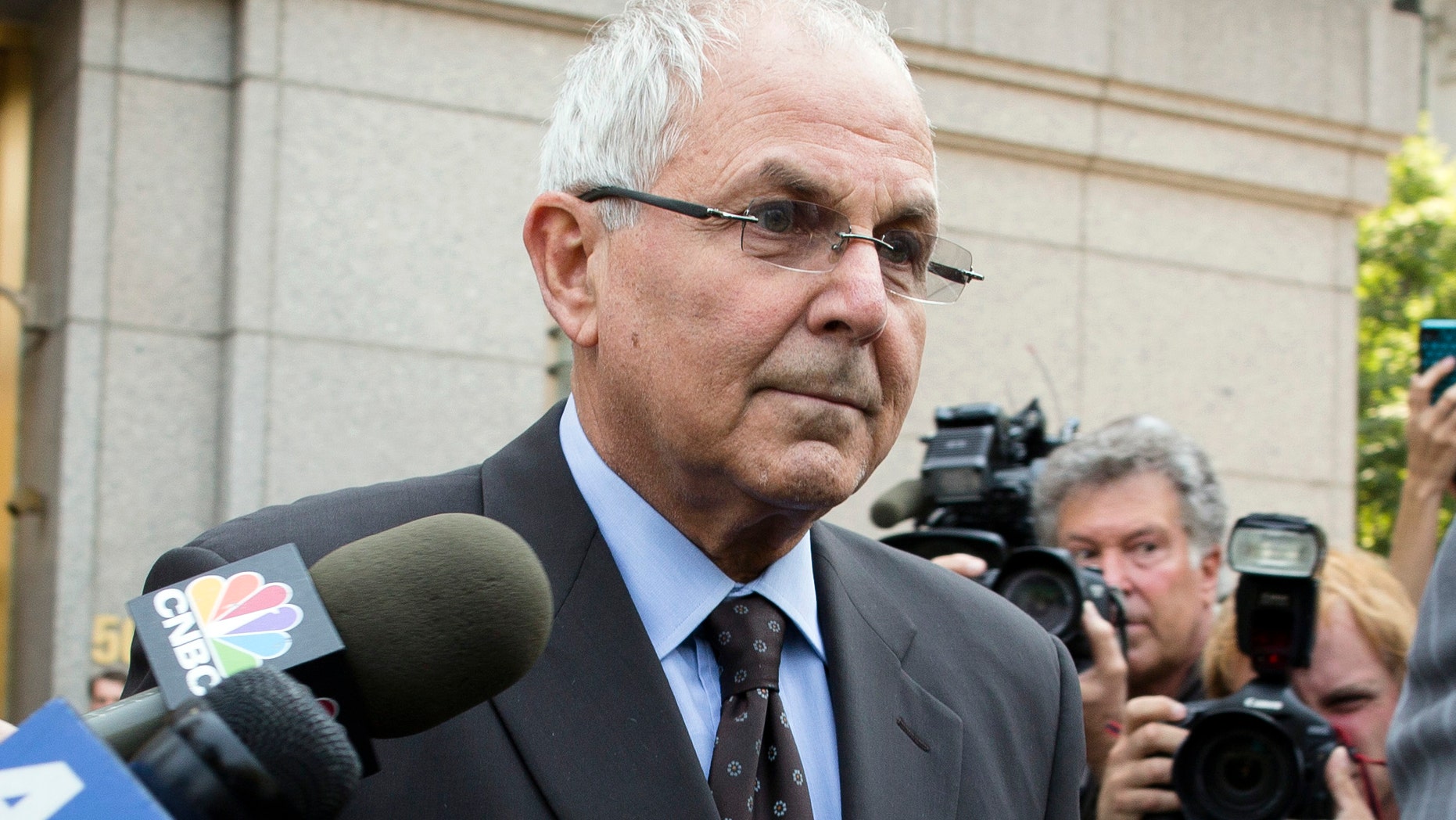 FILE - In this June 29, 2012 file photo, Peter Madoff leaves Federal Court in New York after pleading guilty to criminal charges. The prison-bound brother of Wall Street swindler Bernard Madoff has attended his granddaughter's bat mitzvah in New York. Peter Madoff was sentenced in December to 10 years in prison for his role in the massive Ponzi scheme. The judge delayed his lockup date so he could attend the Jewish ceremony. The 67-year-old pleaded guilty in June to charges that he created false documents while he was chief compliance officer at his brother's firm. (AP Photo/John Minchillo, File)