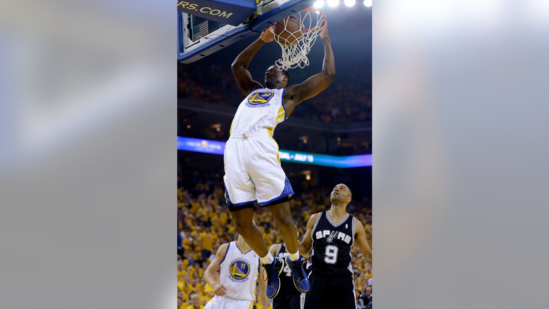 Golden State Warriors forward Harrison Barnes (40) dunks against the San Antonio Spurs in the first quarter of Game 6 of a Western Conference semifinal NBA basketball playoff series in Oakland, Calif., Thursday, May 16, 2013. (AP Photo/Marcio Jose Sanchez)