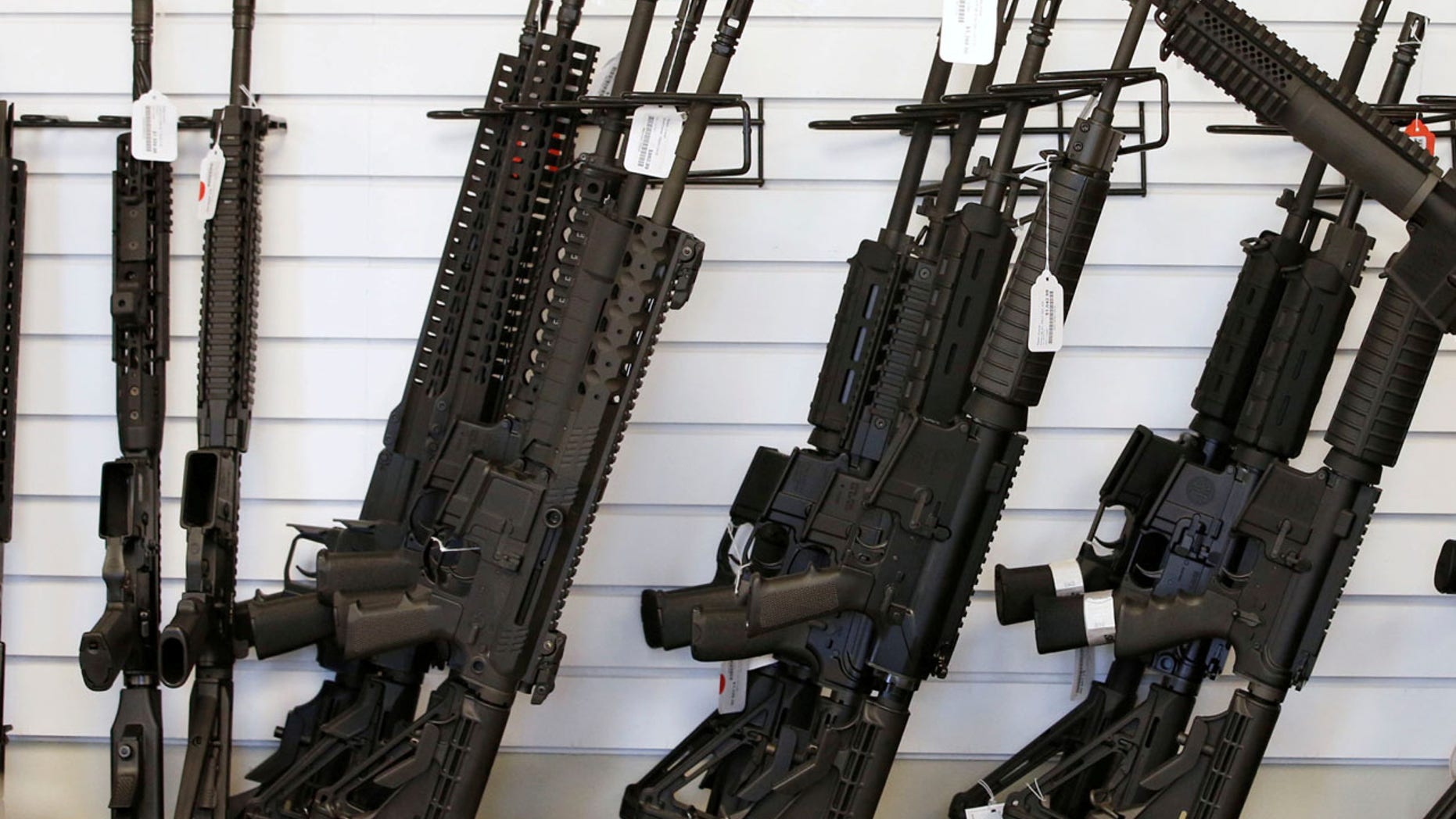 FILE: Guns seen at a store in Provo, Utah. Federal authorities requested thousands of gun retrievals in 2016.