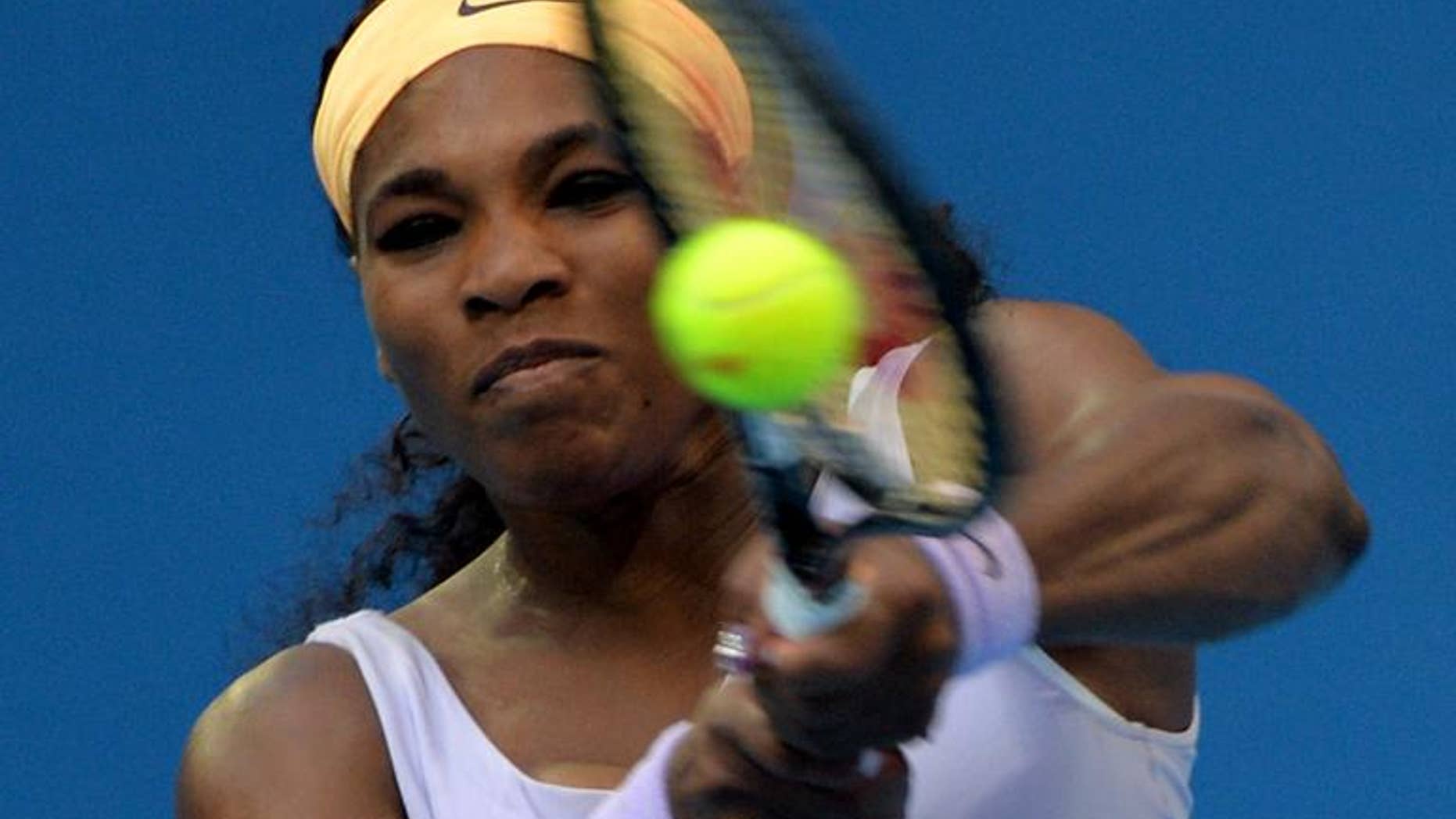 Serena Williams plays a shot during her match against Francesca Schiavone at the China Open in Beijing on October 1, 2013