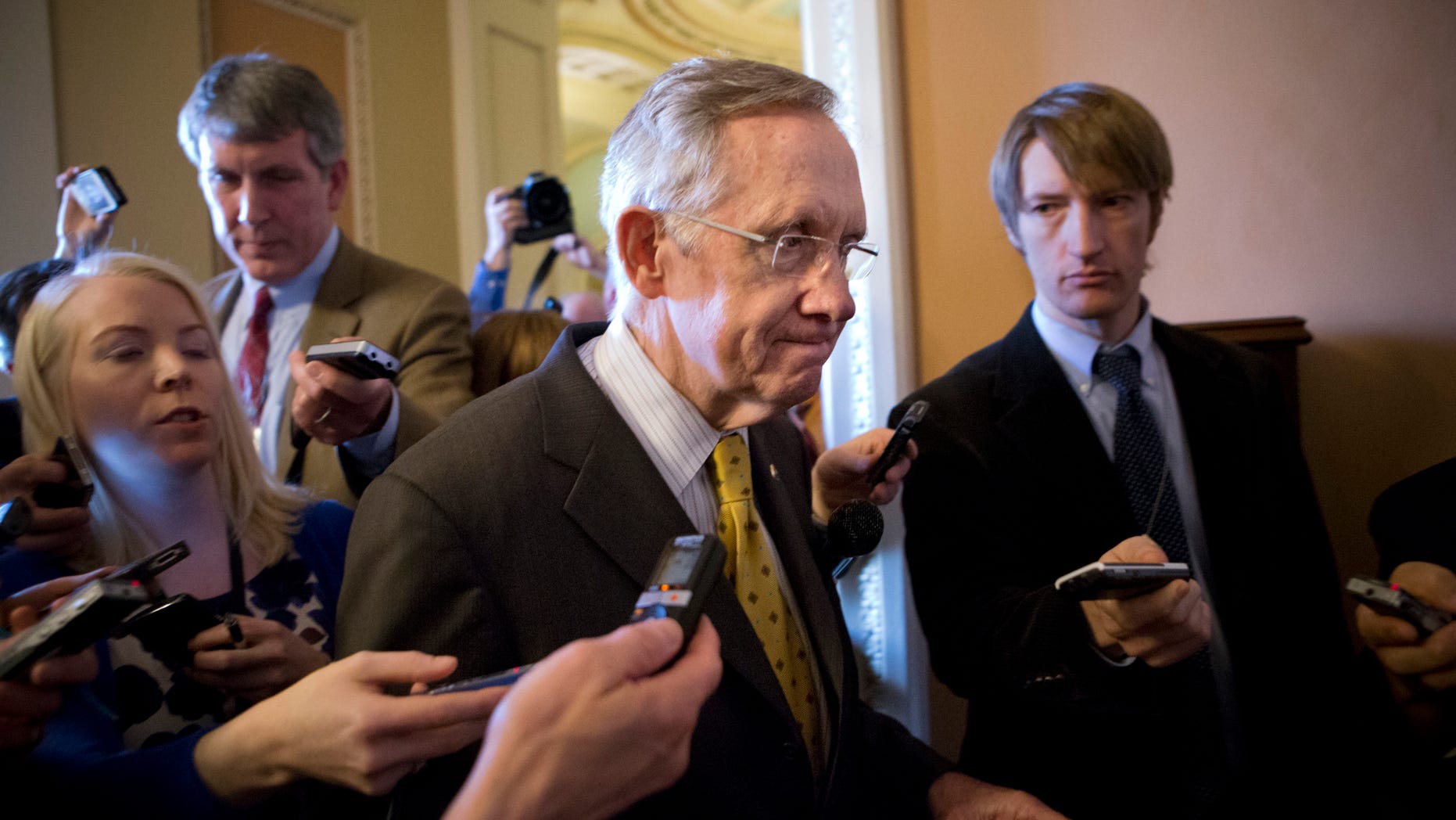 FILE: Dec. 30, 2012: Senate Majority Leader Harry Reid walks to meeting on Capitol Hill, in Washington, D.C.
