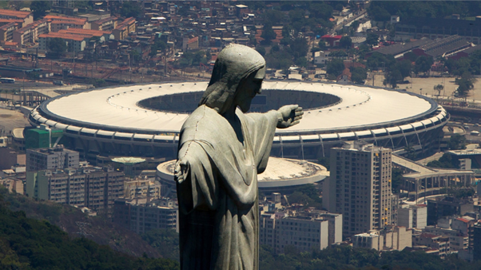 RIO DE JANEIRO, BRAZIL - NOVEMBER 12: An aerial view of the Christ The Redeemer statue (F) and the Maracana Stadium (B) on November 12, 2013 in Rio de Janeiro, Brazil. (Photo by Buda Mendes/Getty Images)