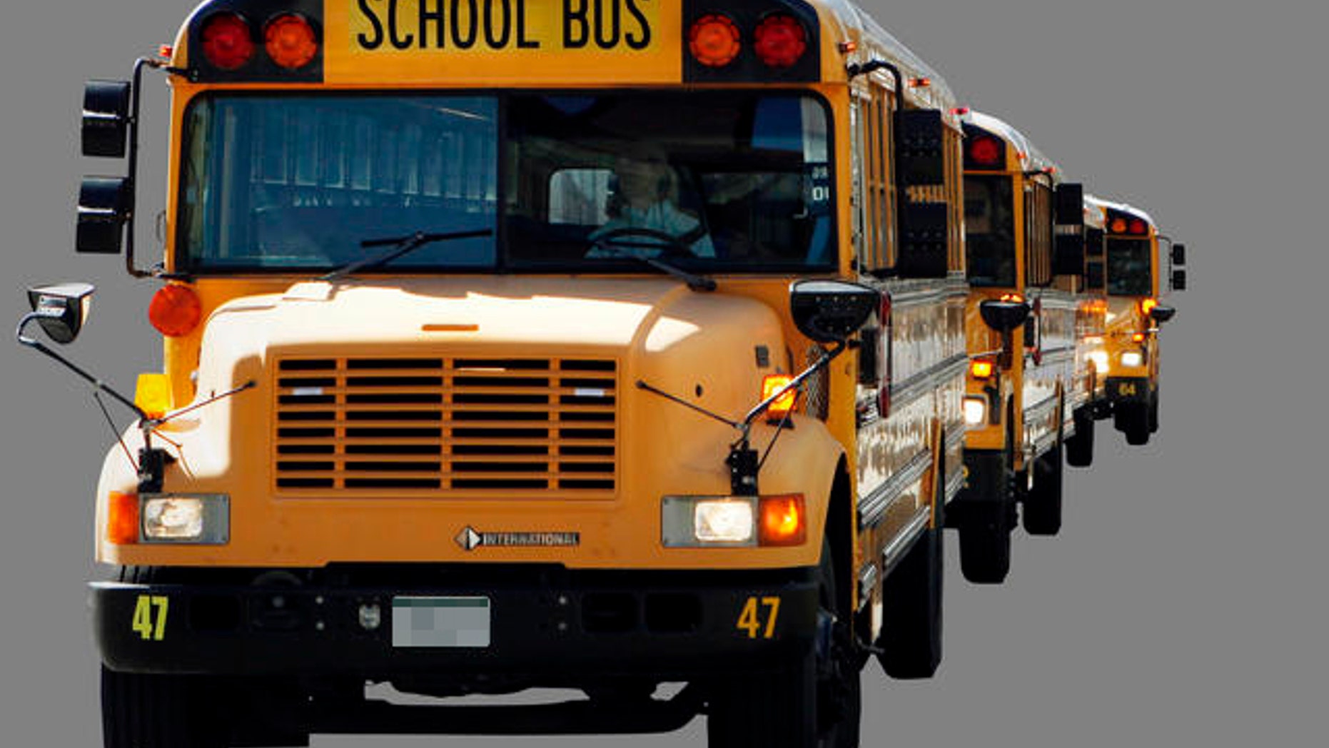 About 50 buses from Falcon School District 49 circled the state Capitol on Thursday March 31, 2011, with messages for lawmakers considering cutting education funding. The messages included "NO CUTS" and "DRIVING OUR FUTURE." (AP Photo/Ed Andrieski)