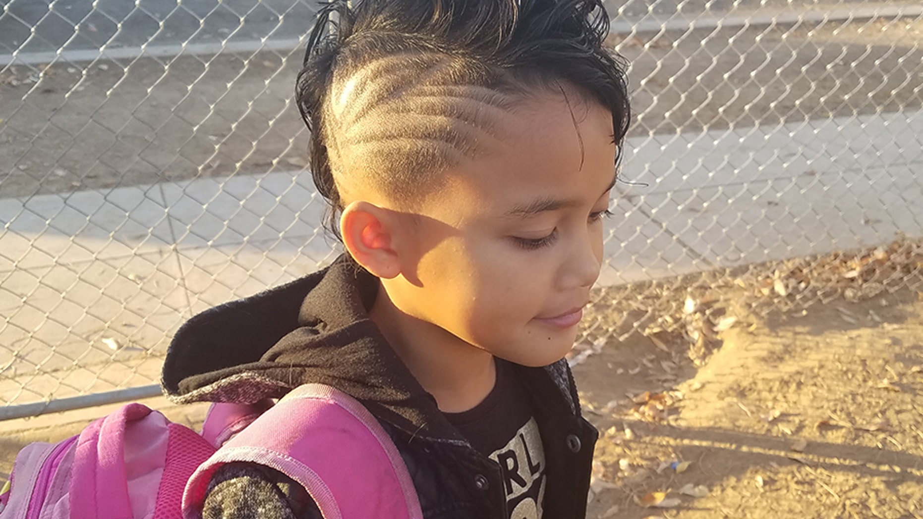 Though the eight-year-old girl from California has rocked buzzed hairstyles since preschool, a teacher recently singled her out for her "distracting haircut."