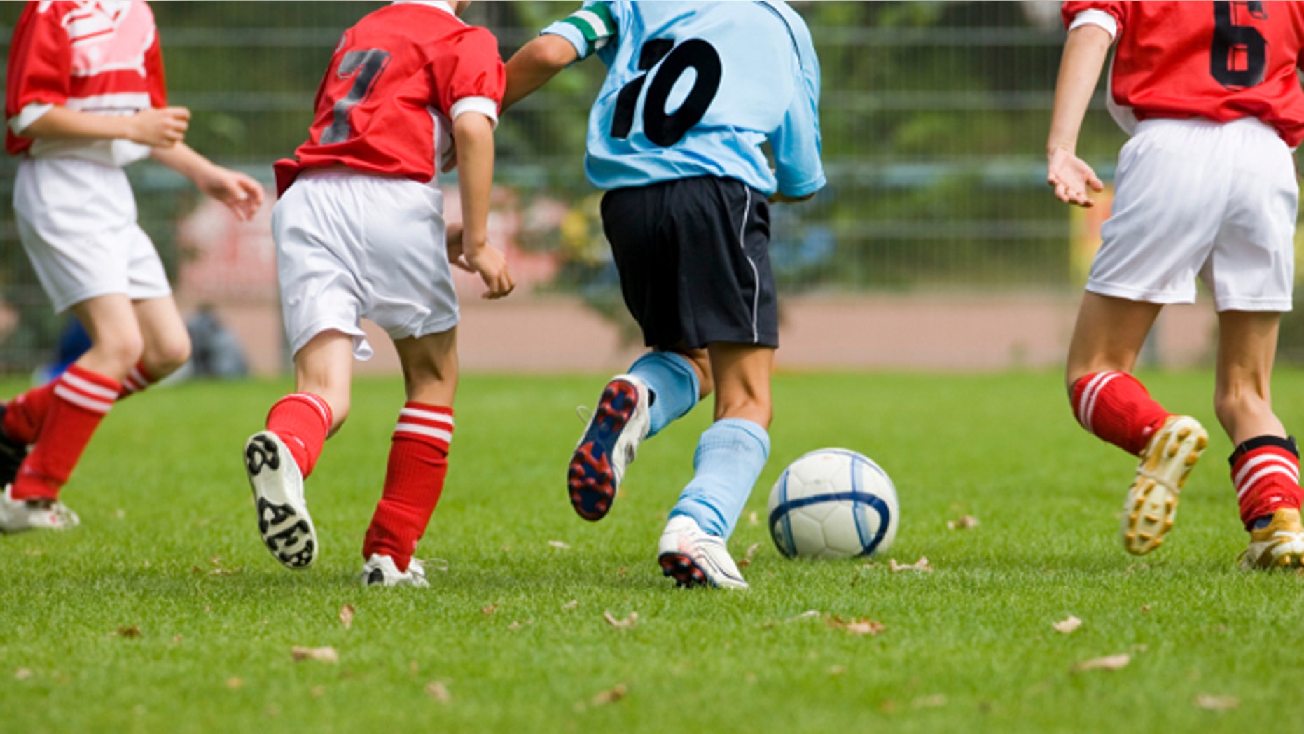 Detail of a soccer game with four players in action