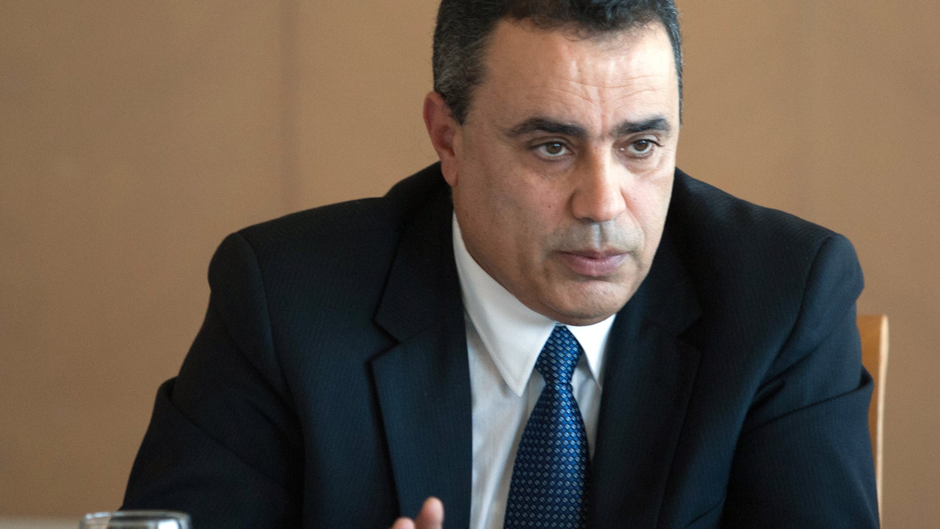 FILE - In this Nov. 7, 2013 photo, Mehdi Jomaa answers questions during a presser held in Tunis, Tunisia. Jomaa, an engineer and the former industry minister, has been selected to replace Larayedh and is expected to present his new cabinet later Thursday. (AP Photo, File)