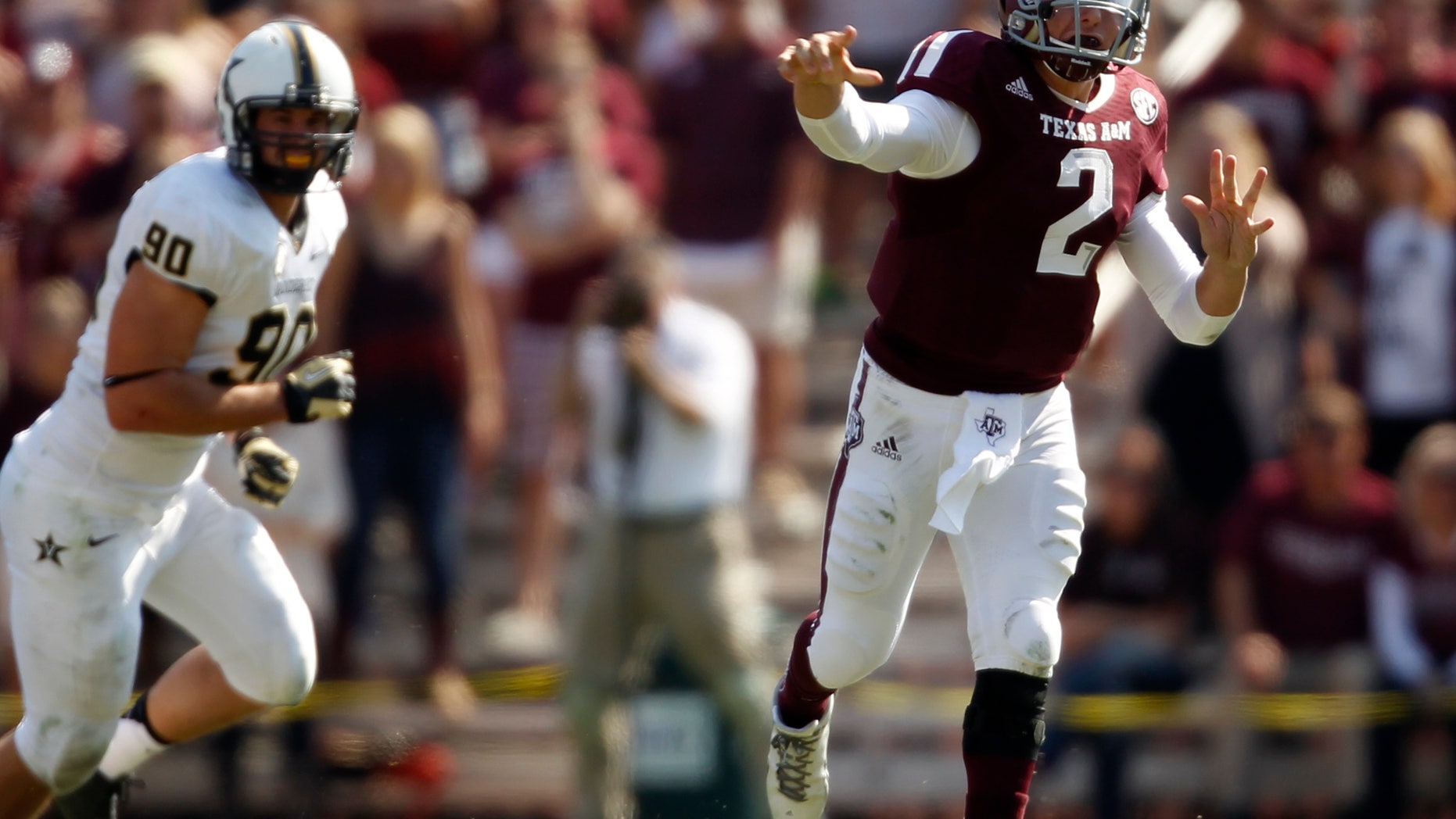 Texas A&M's Johnny Manziel (2) throws a pass during the first half of an NCAA college football game against Vanderbilt, Saturday, Oct. 26, 2013, in College Station, Texas. (AP Photo/Eric Christian Smith)