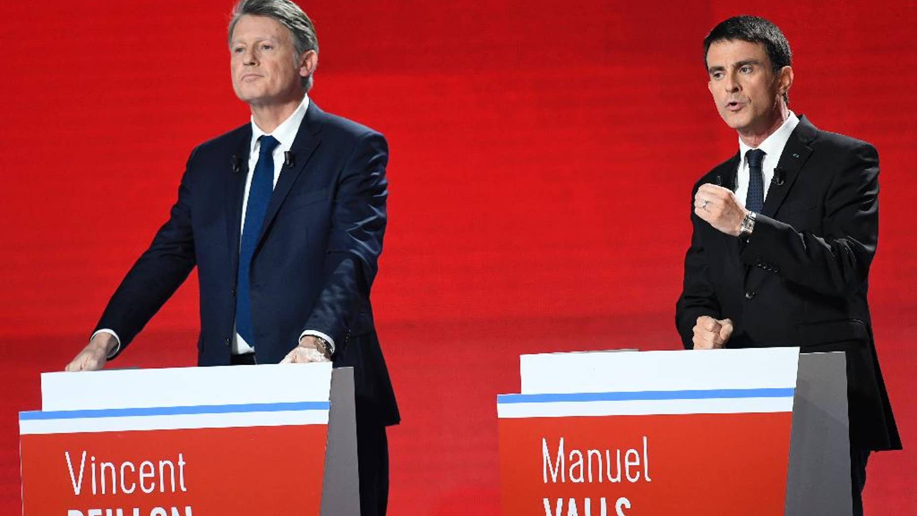 Candidates for the French left's presidential primaries ahead of the 2017 presidential election, Vincent Peillon, left, and Manuel Valls take part in the second televised debate in Paris, France, Sunday, Jan. 15, 2016. Seven competitors are bidding to be the Socialist Party's candidate in next spring's French presidential election. (Bertrand Guay/Pool Photo via AP)