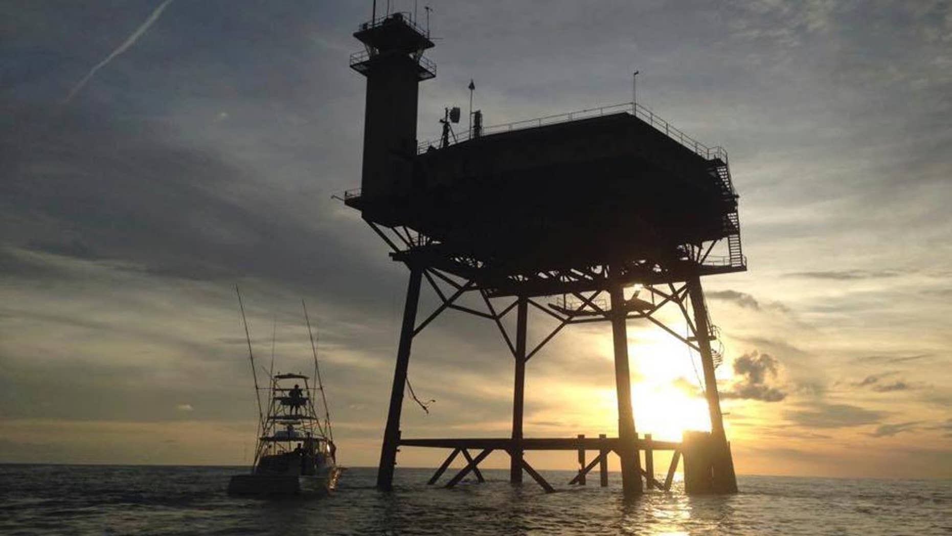 This photo provided by Jacob Jordan shows Frying Pan Tower. A North Carolina man and his fiancee are riding out Hurricane Matthew on top of the old Coast Guard light station more than 30 miles off the Atlantic coast. Richard Neal is the owner of Frying Pan Tower, a platform that is about 100 or so feet above the ocean, only reachable by helicopter or boat. While the 360-degree views of sunsets and sunrises are amazing, there's no land in sight. (Jacob Jordan via AP)