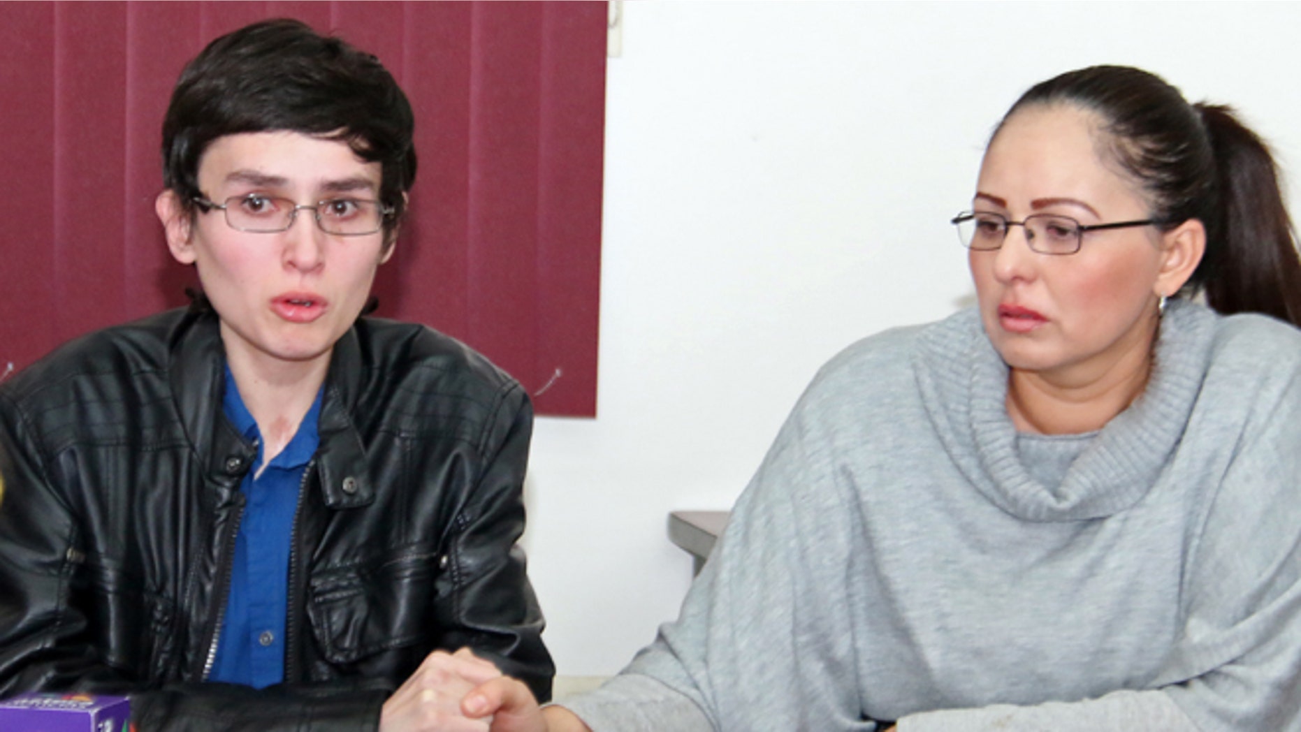 In this May 2, 2014 photo, Jose Chua Lopez and his mother during a news conference in Hermosillo, Mexico.