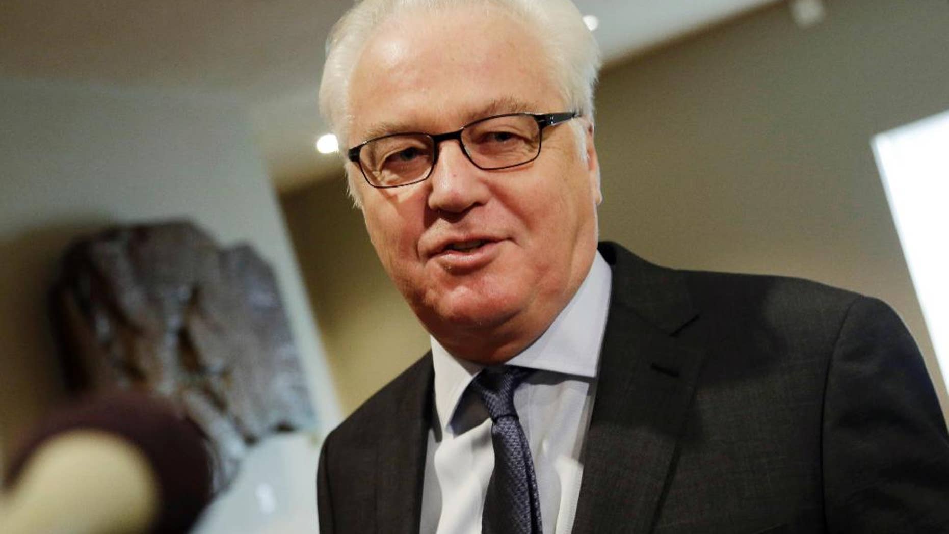 FILE- In this Feb. 7, 2016, file photo, Russia's United Nations Ambassador Vitaly Churkin makes comments to the media prior to a Security Council meeting at U.N. headquarters. Churkin told reporters Wednesday, April 27, that the two hardline Islamic groups — Jaish al-Islam, or the Army of Islam, and Ahrar al-Sham — aren't observing the cessation of hostilities in Syria "and are engaged in terrorist activities" and therefore should be subject to sanctions. (AP Photo/Mark Lennihan, File)