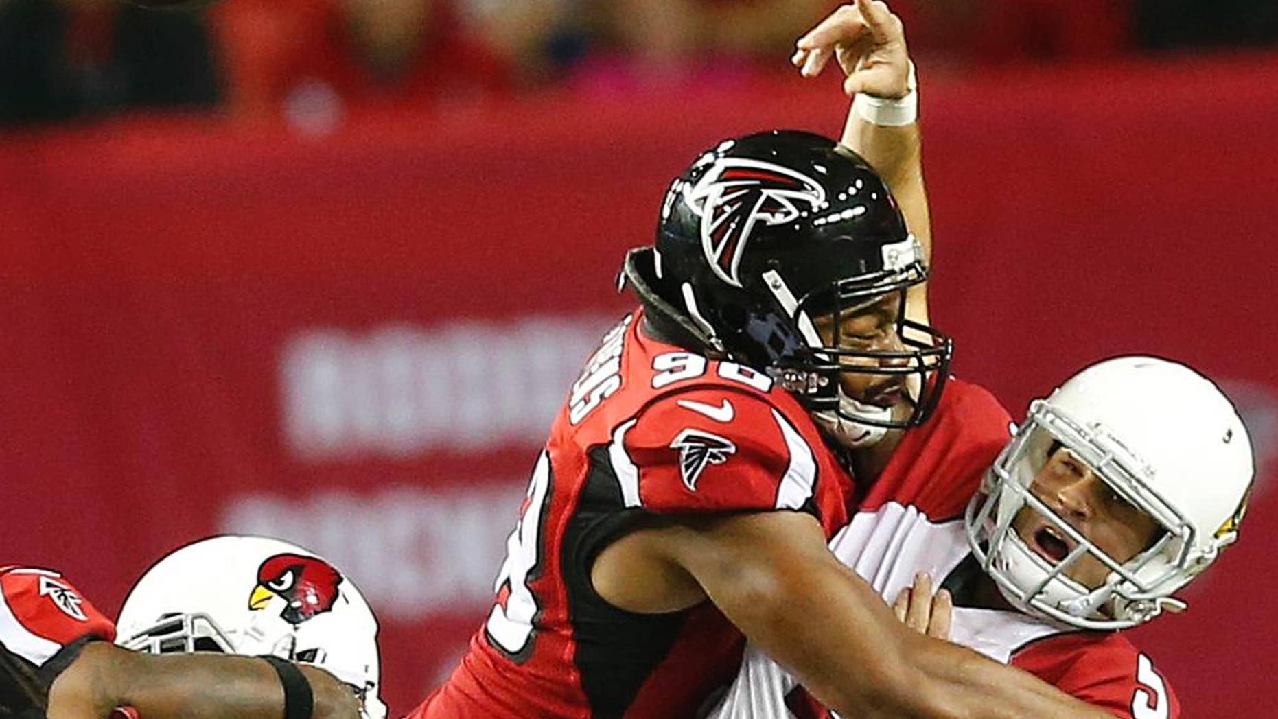 Atlanta Falcons cornerback Desmond Trufant (21) runs back a fumbled ball against the Arizona Cardinals during the first half of an NFL football game, Sunday, Nov. 30, 2014, in Atlanta. (AP Photo/Brynn Anderson)