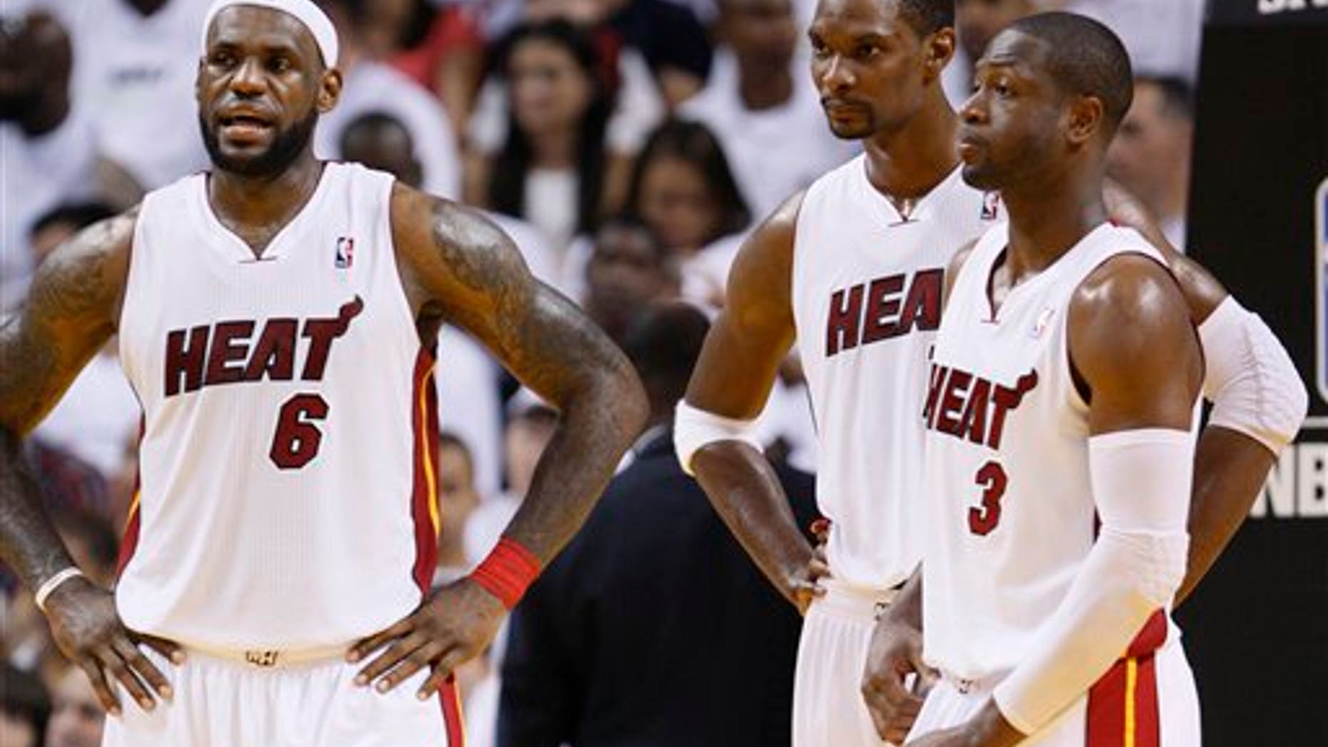 April 16: Miami Heat's LeBron James (6) Chris Bosh, center, and Dwyane Wade (3) are shown during the second half of Game 1 of a first-round NBA playoff basketball series against the Philadelphia 76ers in Miami. The Heat defeated the 76ers 97-89. (AP)