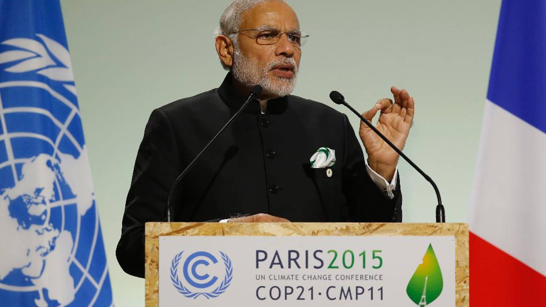 FILE- In this Nov. 30, 2015 file photo, India's Prime Minister Narendra Modi addresses world leaders at the COP21, United Nations Climate Change Conference, in Le Bourget, outside Paris. India's leader says his country will ratify the Paris Agreement on climate change early next month. Modi said Sunday that his government will ratify the agreement Oct. 2, coinciding with the birth anniversary of India's independence leader Mohandas Gandhi. (AP Photo/Michel Euler, File)