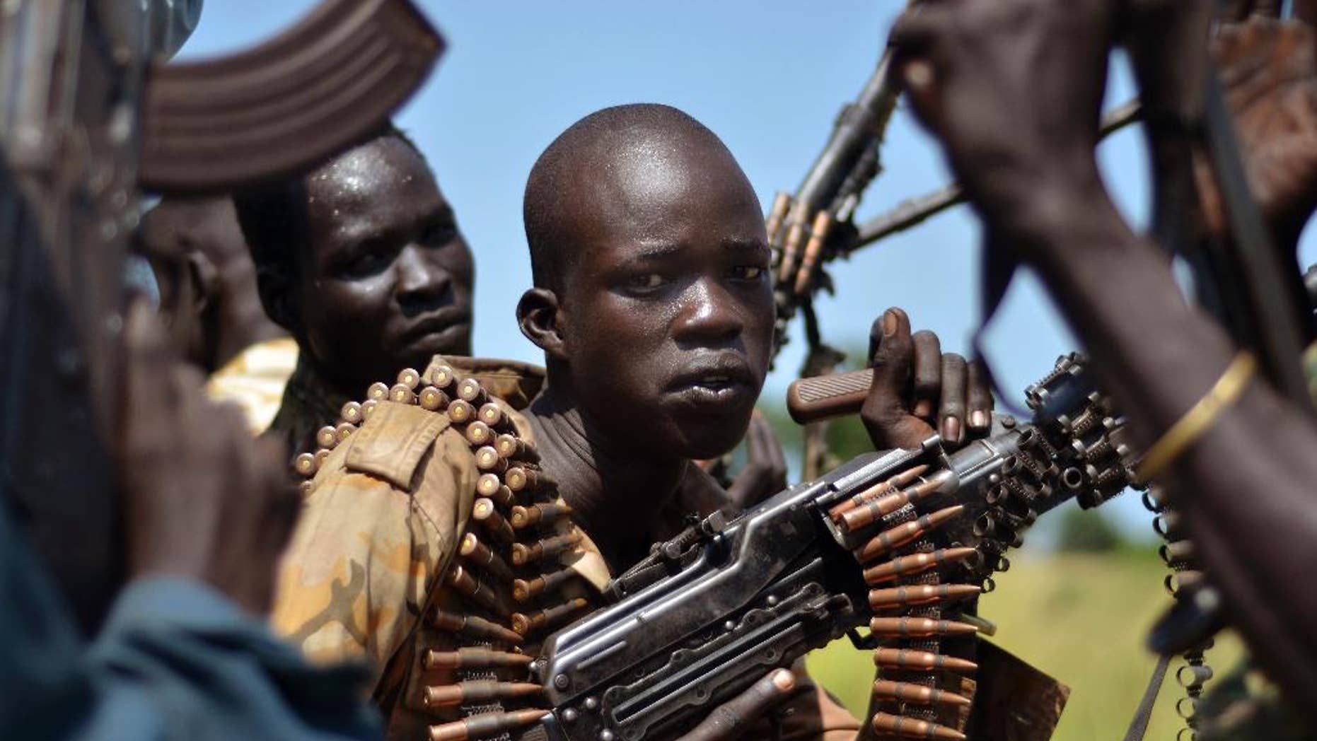 FILE-- In this file photo of Friday, Sept. 25, 2015. South Sudan government soldiers in the town of Koch, Unity state, South Sudan. Fifty-two soldiers and rebels have been killed in recent fighting in South Sudan’s contested state of Unity, a military official Saturday, blaming rebels for the latest violation of a peace deal signed last month amid high hopes for peace. ((AP Photo/Jason Patinkin-file)
